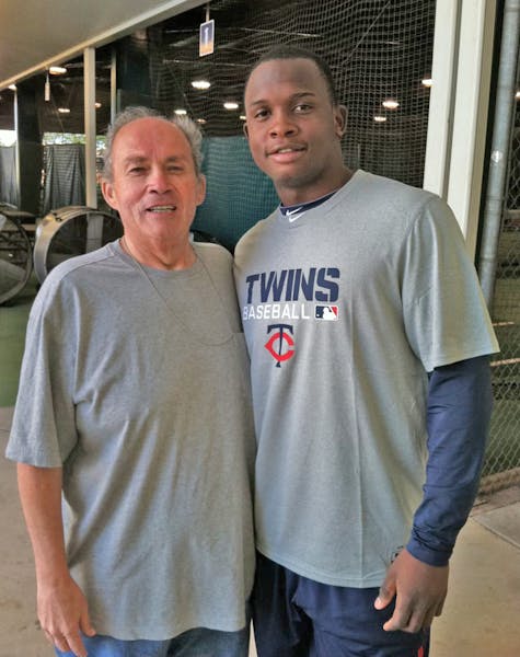 Patrick Reusse with Miguel Sano in 2015.
