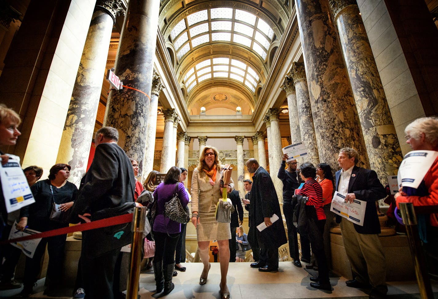 Senator Julie Rosen, R-Vernon Center, made her way past ISAIAH members gathered outside the Senate Chamber. ] GLEN STUBBE * gstubbe@startribune.com Thursday, April 23, 2015 Drivers license legislation has been added to the Senate Transportation Omnibus Bill. Prior to the vote, members of ISAIAH visited with legislators and held a faith rally and prayer vigil outside of the Senate chamber in the State Capitol.