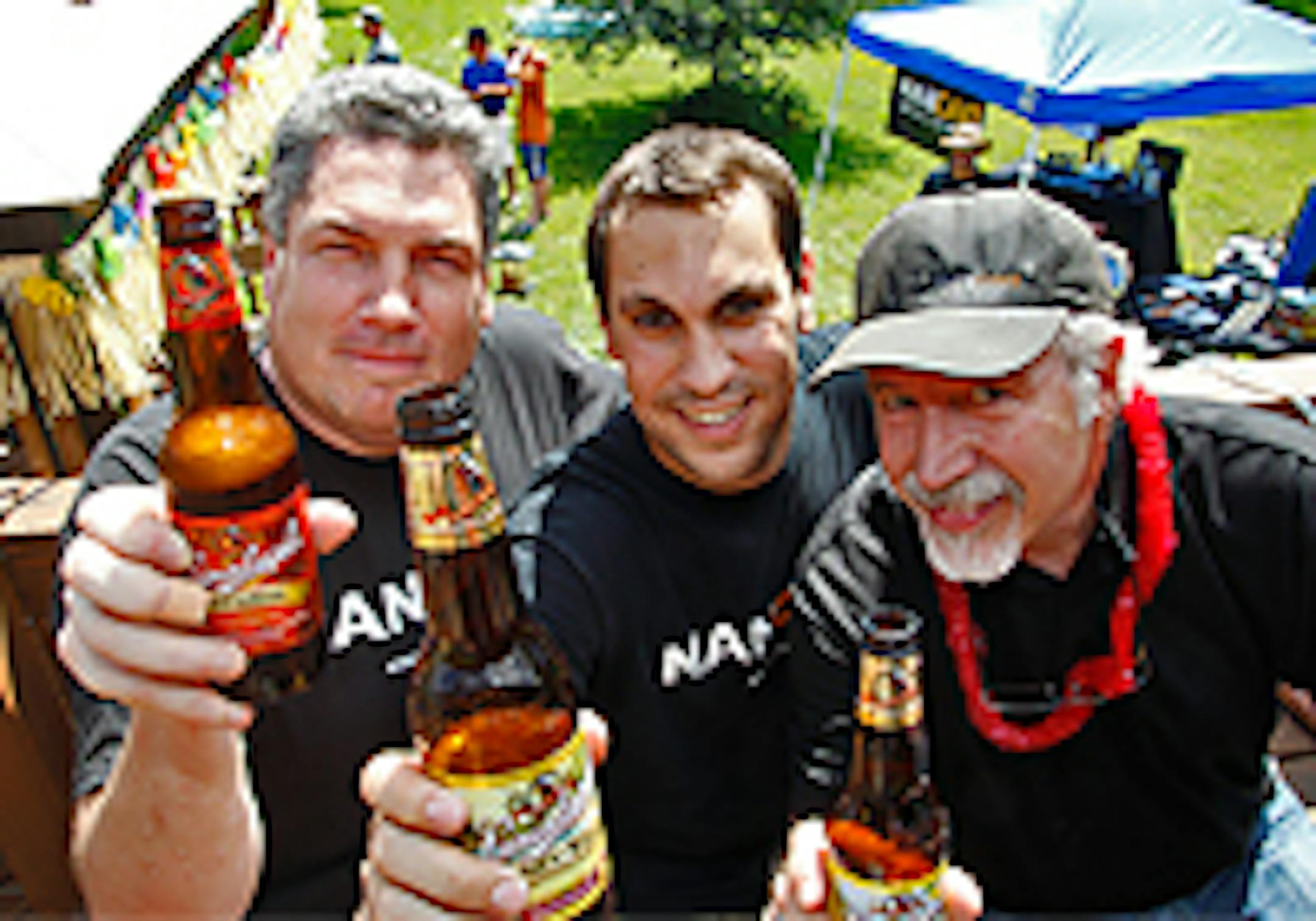 Man Cave Worldwide's Nick Beste, center, with "meat-ing" host Dave Williams, left, and sales rep Doug Stewart
