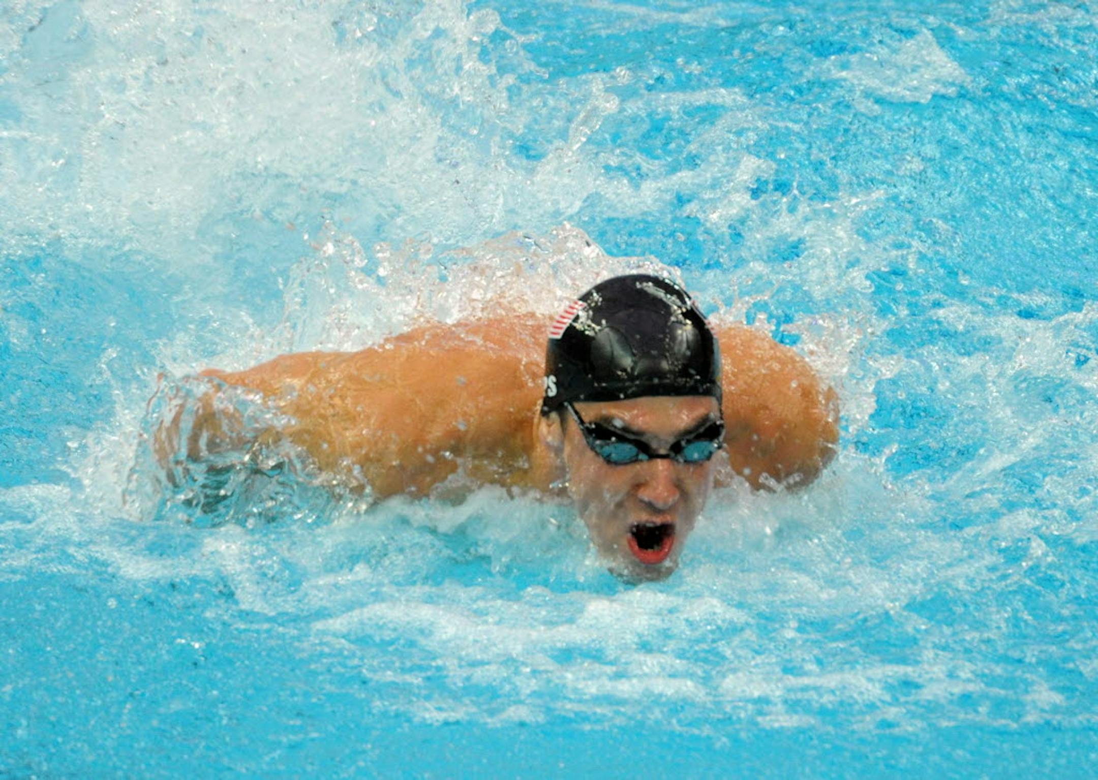 Michael Phelps of the United States swims the butterfly leg on the way to winning gold in the 4x100 medley, Phelps' eight gold of the games, on Sunday August 17, 2008, in the Games of the XXIX Olympiad in Beijing, China.