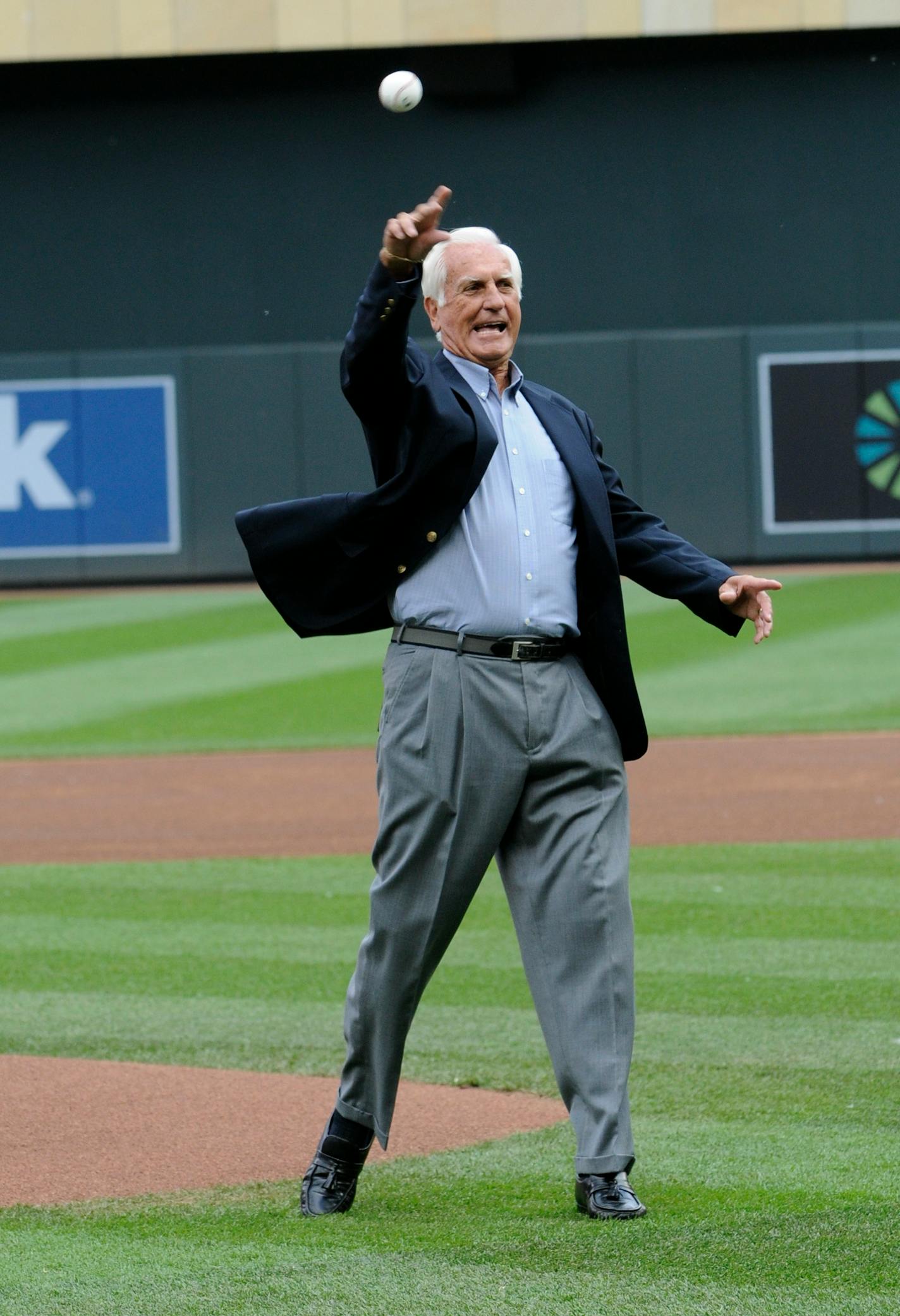 Former Minnesota Twins pitcher Jim Perry throws out the ceremonial first pitch after being inducted into the Twins Hall of Fame before a baseball game against the Texas Rangers, Saturday, June 11, 2011, in Minneapolis. (AP Photo/Jim Mone)