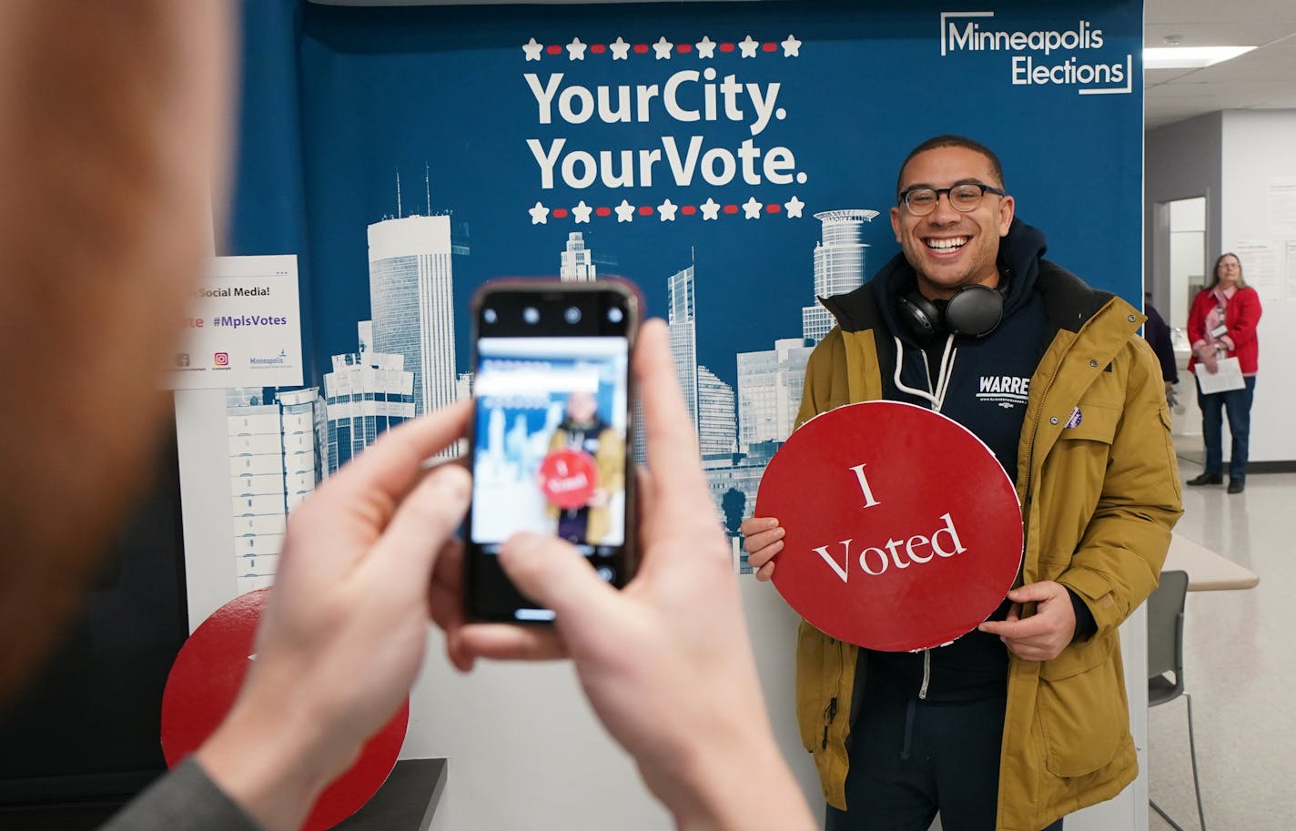 The Minneapolis Early Voting Center provided oversized "I Voted" signs, perfect for photos as Jared Mollenkof had his photo taken. Jared Mollenkof Davis Senseman and Jared Mollenkof arrived at the Minneapolis Early Voting Center Thursday night so they could be among the first voters in the 2020 election, when the center opens at 8:00 a.m. Friday. They plan to vote for Elizabeth Warren. ] GLEN STUBBE &#x2022; glen.stubbe@startribune.com Friday, January 17, 2020 The