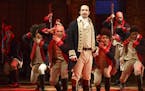 This image released by The Public Theater shows Lin-Manuel Miranda, foreground, with the cast during a performance of "Hamilton," in New York. (Joan M