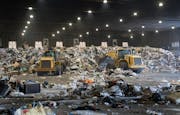 Piles of trash are collected and sorted on the main tipping floor Thursday, Nov. 09, 2023, at Ramsey/Washington Recycling &amp; Energy Center in Newpo