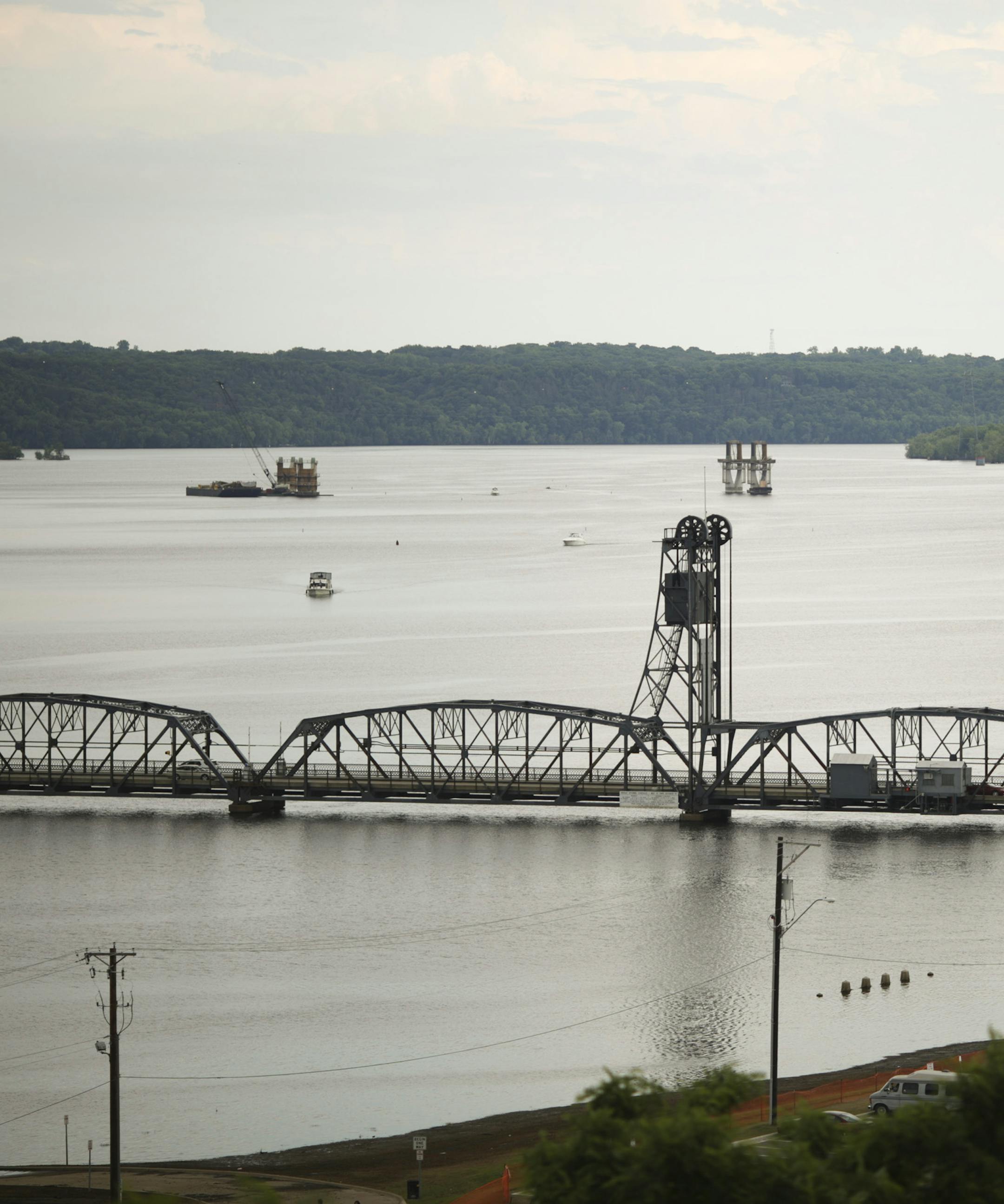A view of the construction progress on the new St. Croix River bridge, rear, with the existing Stillwater lift bridge in the foreground in this view from Pioneer Park in Stillwater Monday afternoon. ] JEFF WHEELER ‚Ä¢ jeff.wheeler@startribune.com The St. Croix River bridge project is now in full swing, accounting for tens of millions of dollars in spending. An establishing shot of the progress so far, seen from Monday afternoon, July 7, 2014.