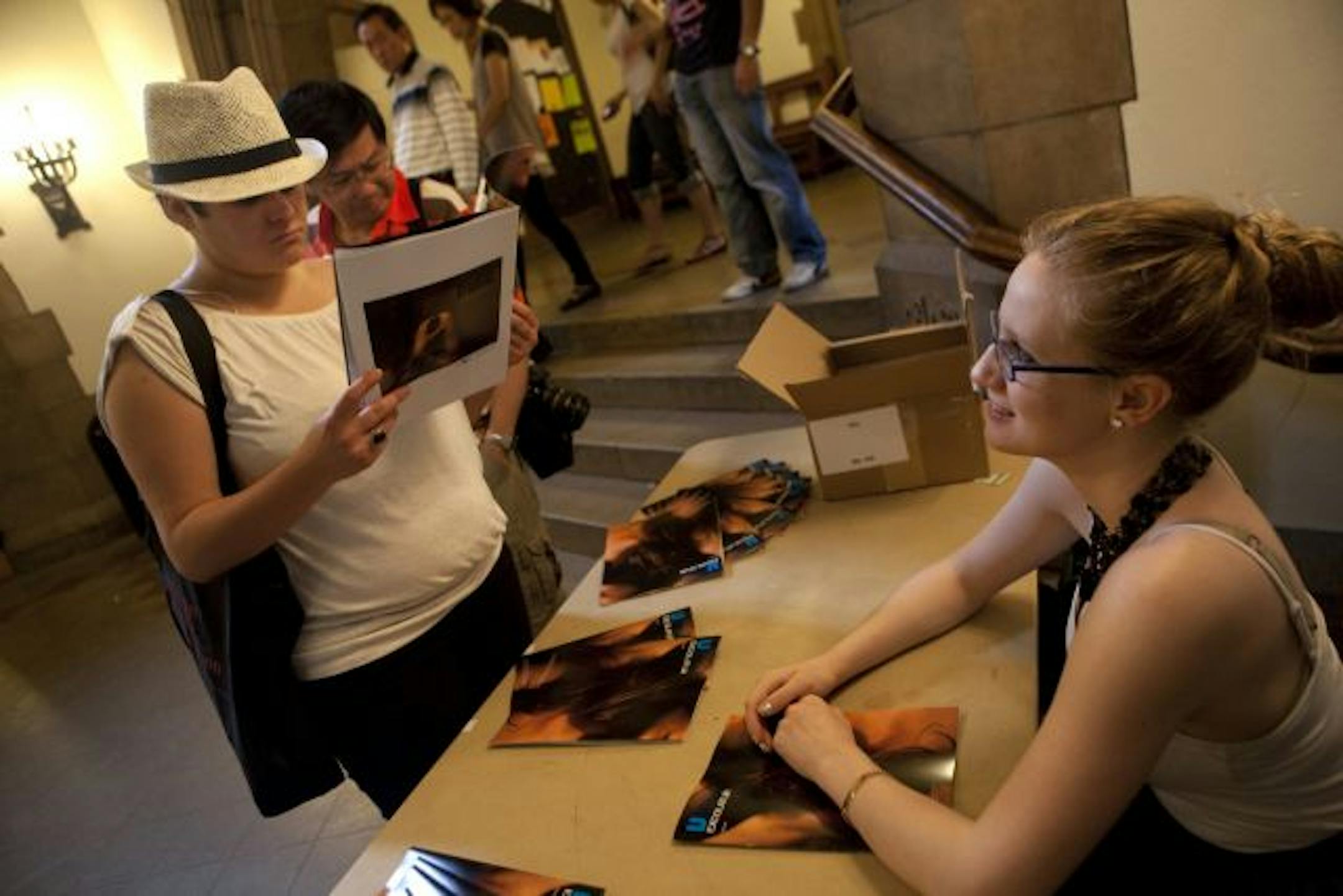 Jackie Todd, right, sold copies of the revived magazine Vita Excolatur for $2 in the student union at the University of Chicago. Todd labored for two years to resurrect the underground magazine, which features provocative photos of UC students.