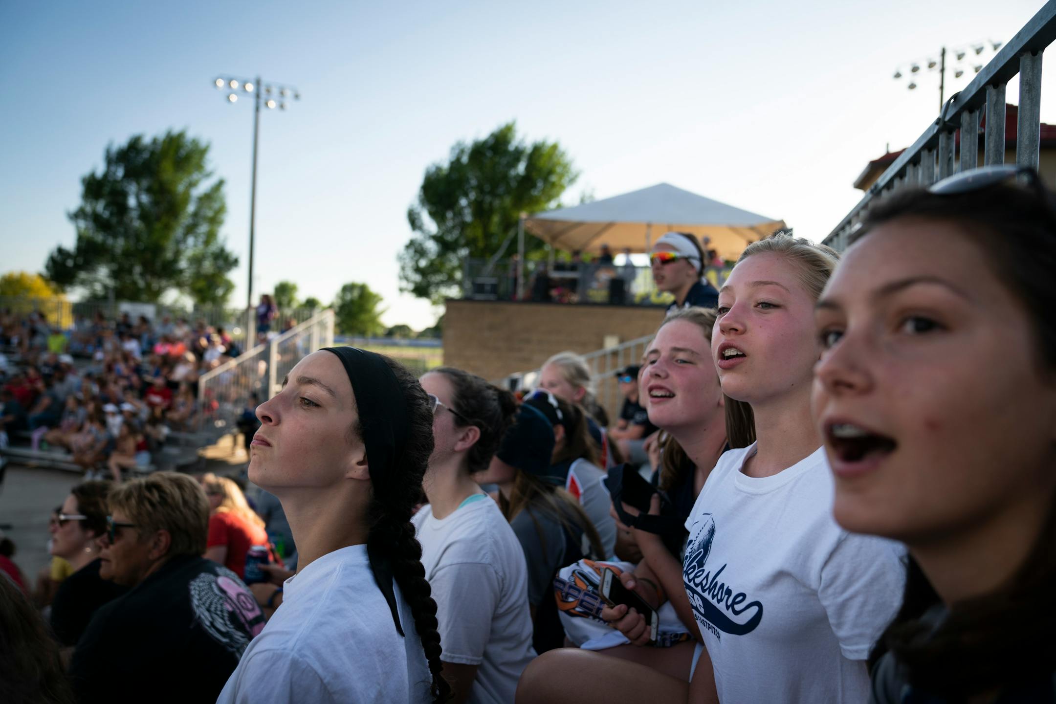 Youth softball players from Manitowoc, wis., including Maria Kraynek, 13, and Eva Eichmann,13, in back row, watched the Aussie Pepper's play the Canadian Wild in North Mankato, Minn. Wednesday, July 3, 2019. The girls were in town part of a recently Pepper's softball tournament.] RENEE JONES SCHNEIDER ¥ renee.jones@startribune.com