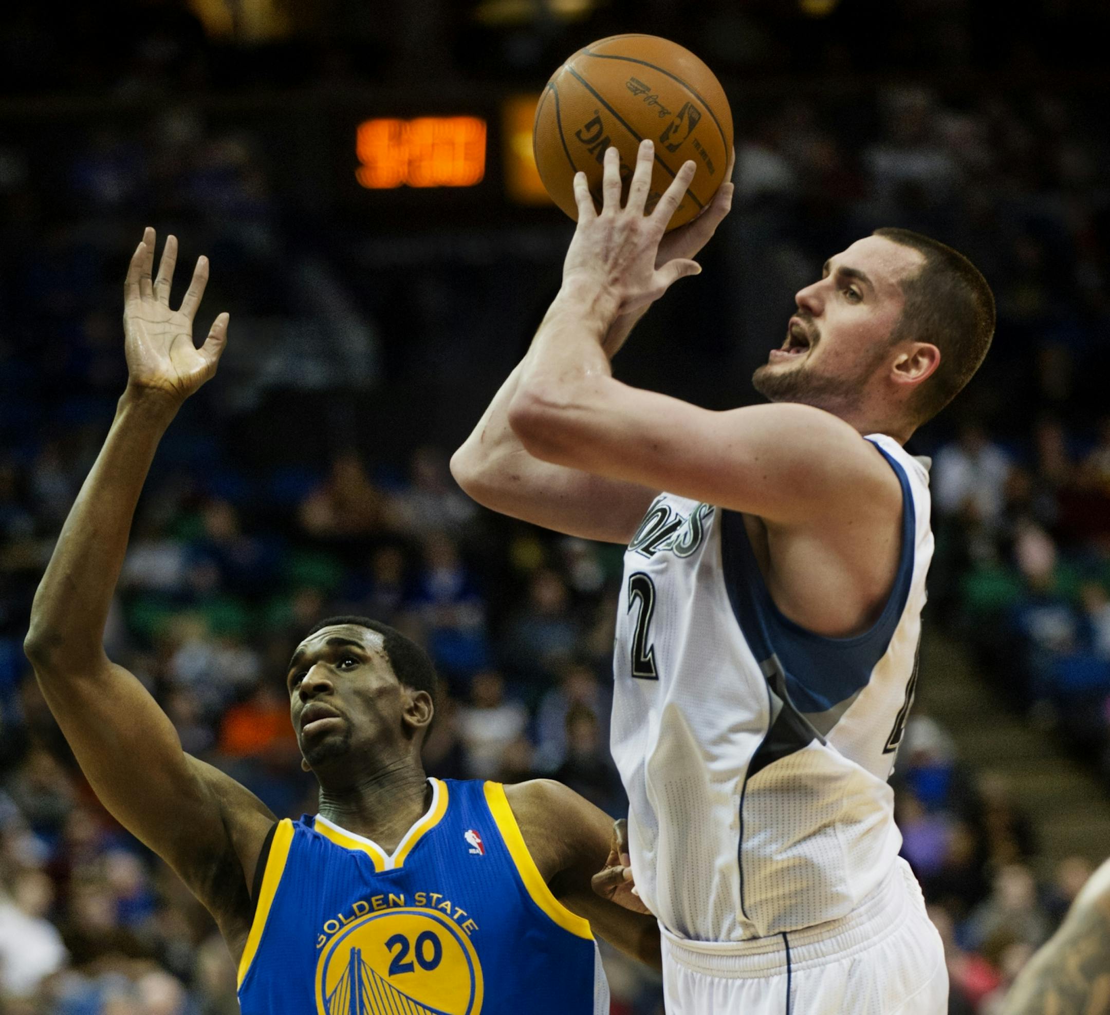 Kevin Love drives past Golden State Warrior Ekpe Udoh in the second half.