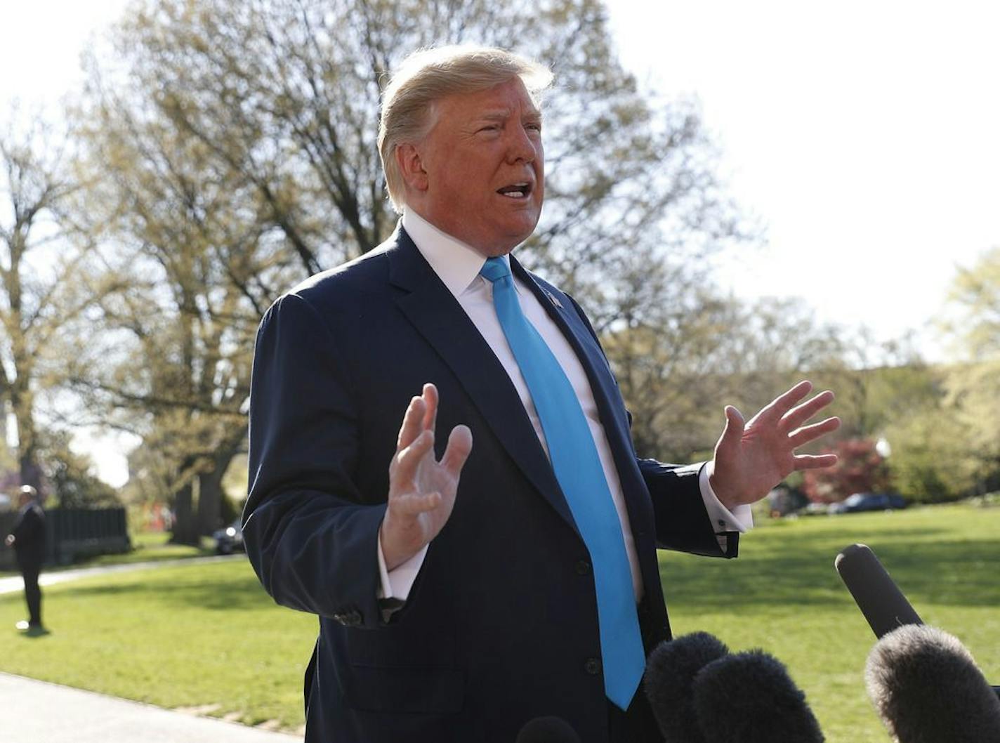 President Trump speaks to members of the media on the South Lawn of the White House in Washington, before boarding Marine One helicopter, Wednesday, April 10, 2019.