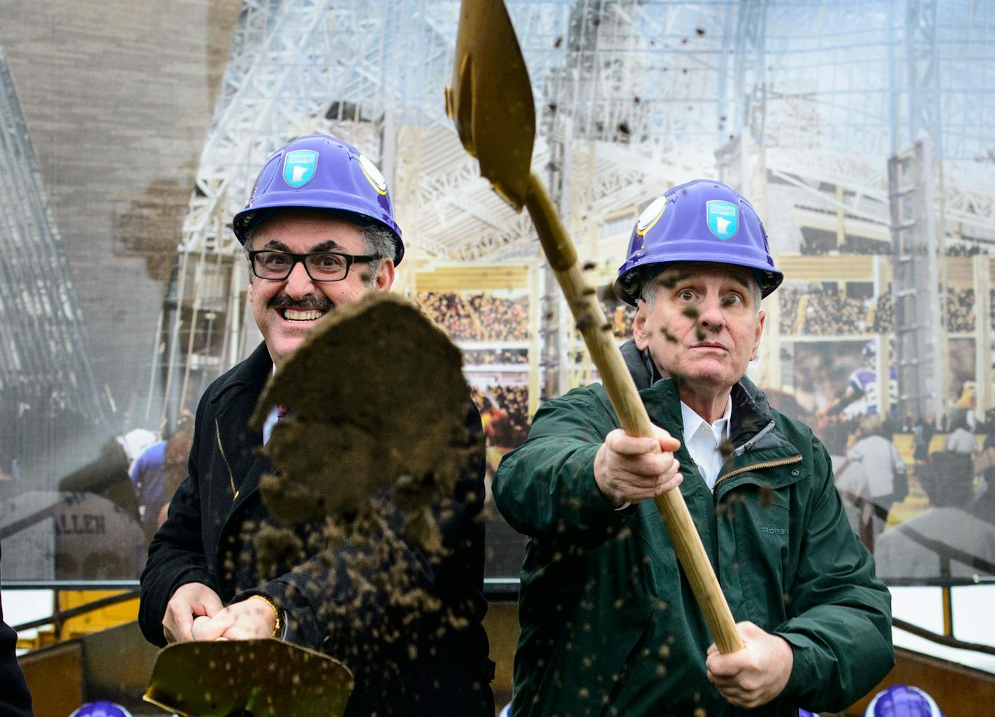 Vikings owner Zygi Wilf and Minnesota Gov. Mark Dayton dig in during the groundbreaking for the new Vikings stadium on Tuesday, Dec. 3, 2013.