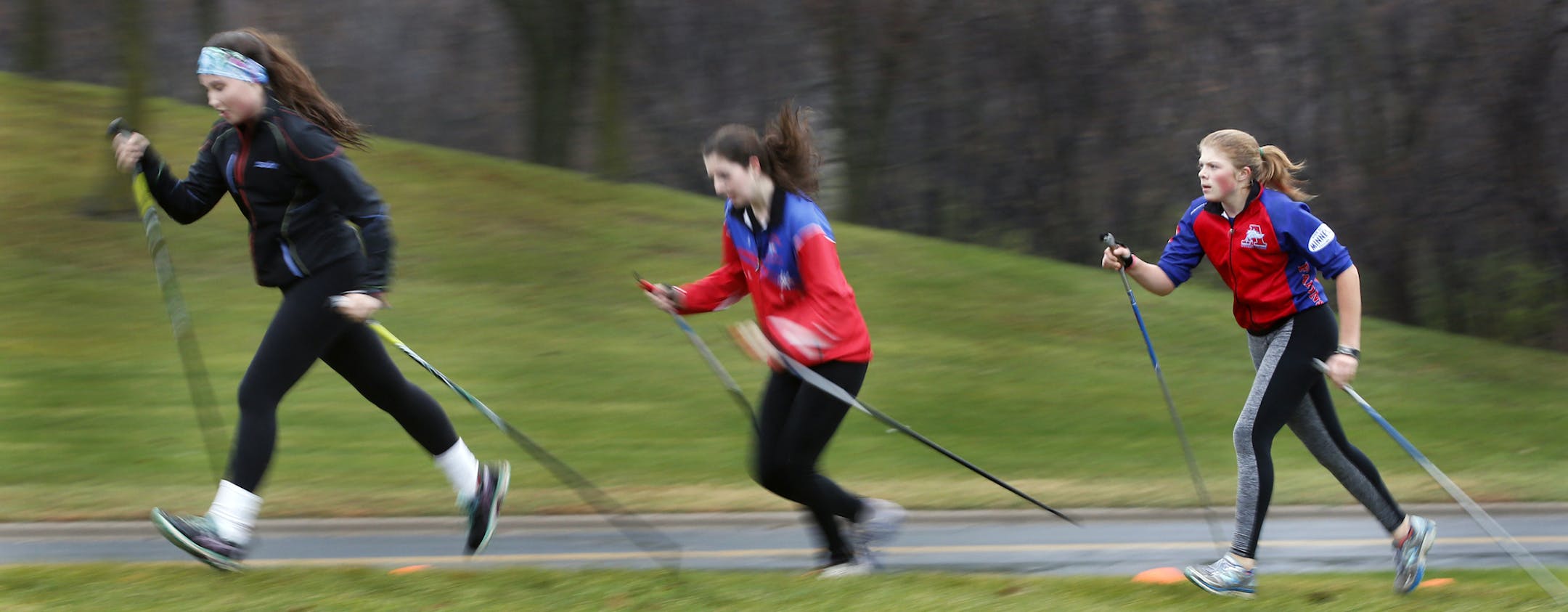 The girls from Armstrong's nordic ski team made due with doing intervals on the adjacent hill since there was snow to ski on.]Richard Tsong-Taatarii/rtsong-taatarii@startribune.com
