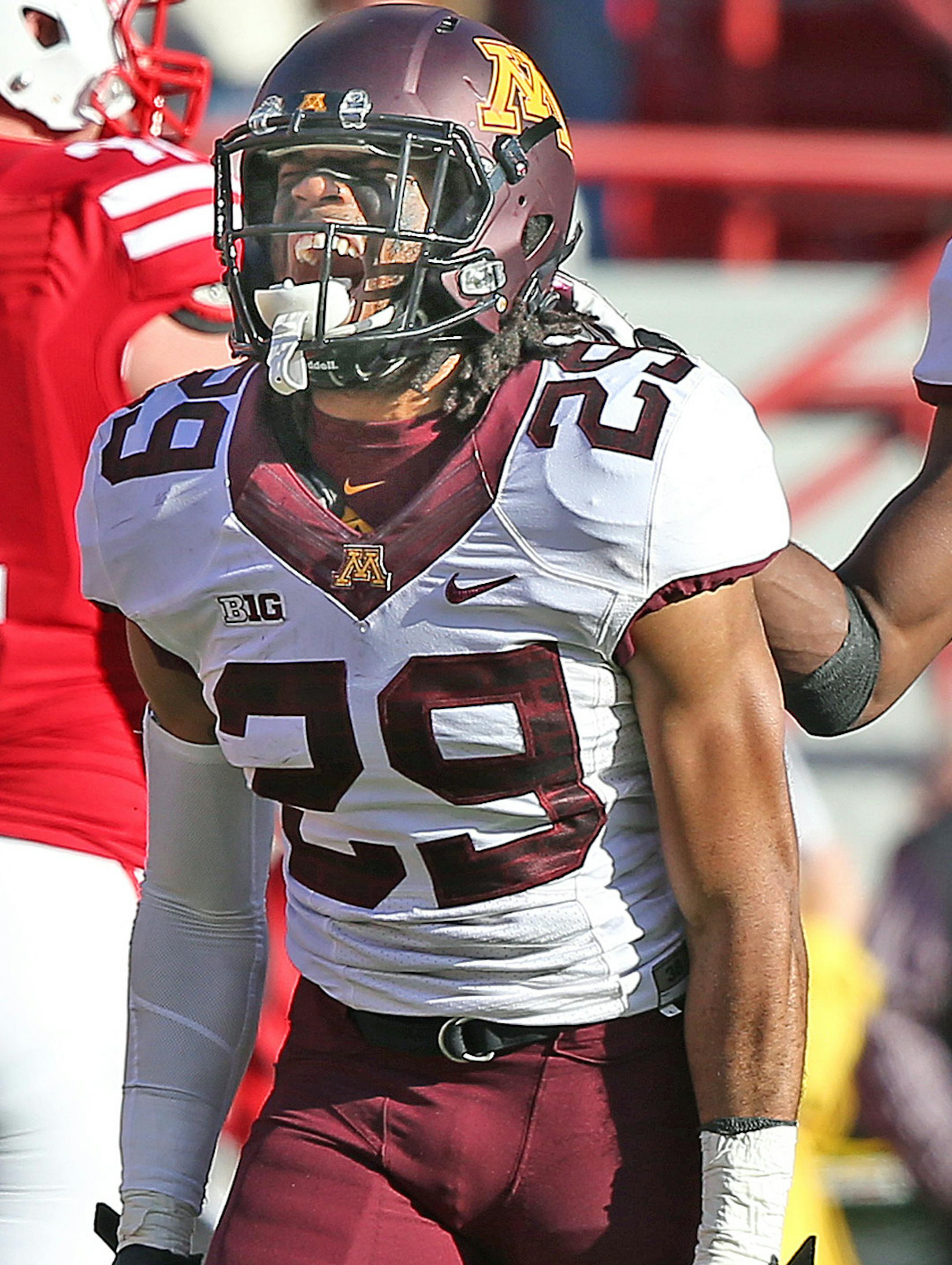 Minnesota's defensive back Briean Boddy-Calhoun (29) and defensive back Eric Murray (31) celebrated a turnover in the fourth quarter as the Minnesota Gophers took on the Nebraska Cornhuskers at Memorial Stadium, Saturday, November 22, 2014 in Lincoln, NE. ] (ELIZABETH FLORES/STAR TRIBUNE) ELIZABETH FLORES • eflores@startribune.com