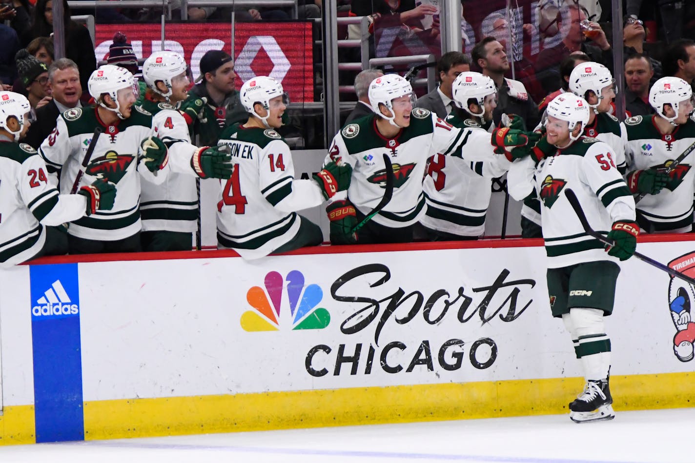 Mason Shaw celebrates his first-career goal with teammates during the first period Sunday night in Chicago.