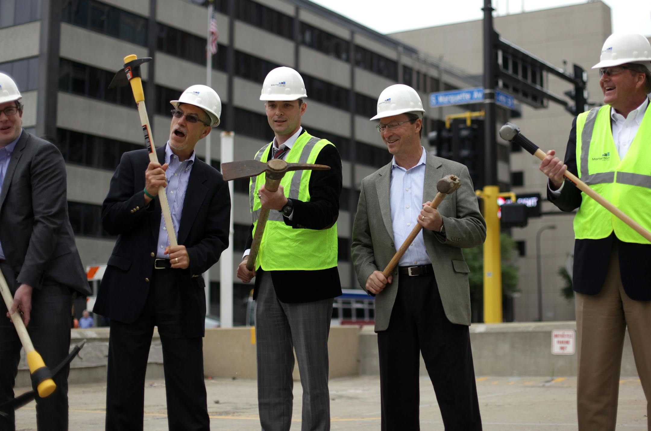From left to right, Chris Caltabiano from AIG, Tim Baydala from AIG, Dan Lessor from Mortenson Development, Terry Baydala from Meridian Capital, and Bob Solfelt, Vice President and general manager of Mortenson development. Mortenson and AIG of New York held an informal groundbreaking at the future site of a 30-story tower in downtown Minneapolis. ] Completion of the tower is slated for the first quarter of 2016.