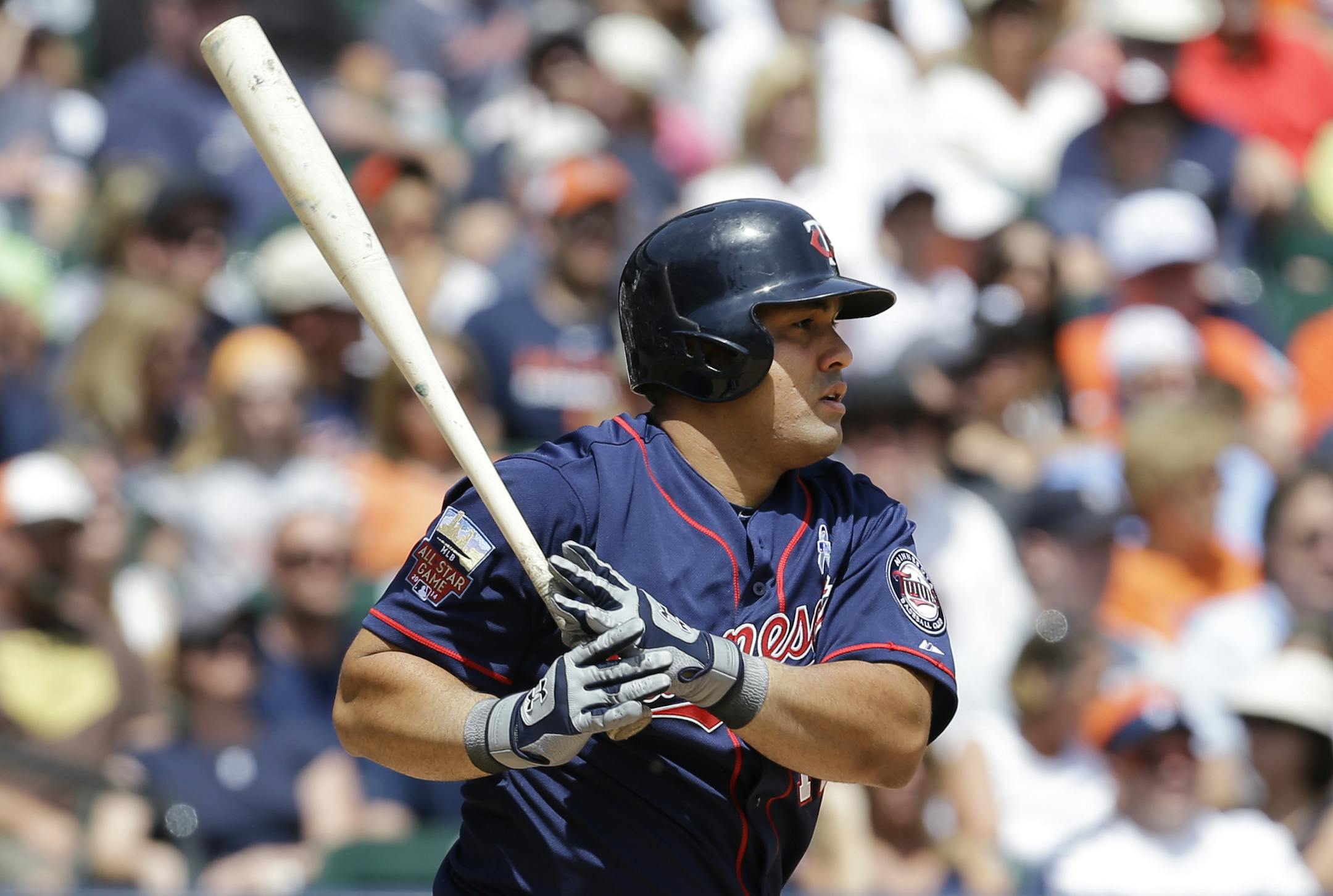 Minnesota Twins designated hitter Kendrys Morales hits a one-run single against the Detroit Tigers in the sixth inning of a baseball game in Detroit, Sunday, June 15, 2014. (AP Photo/Paul Sancya)