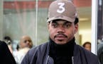 Grammy-winning artist Chance the Rapper walks out of the Thompson Center in Chicago after a meeting with Illinois Gov. Bruce Rauner on Friday, March 3