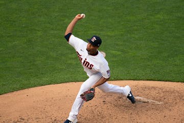 Twins relief pitcher Jorge Alacala (66) threw during live batting practice Monday evening.