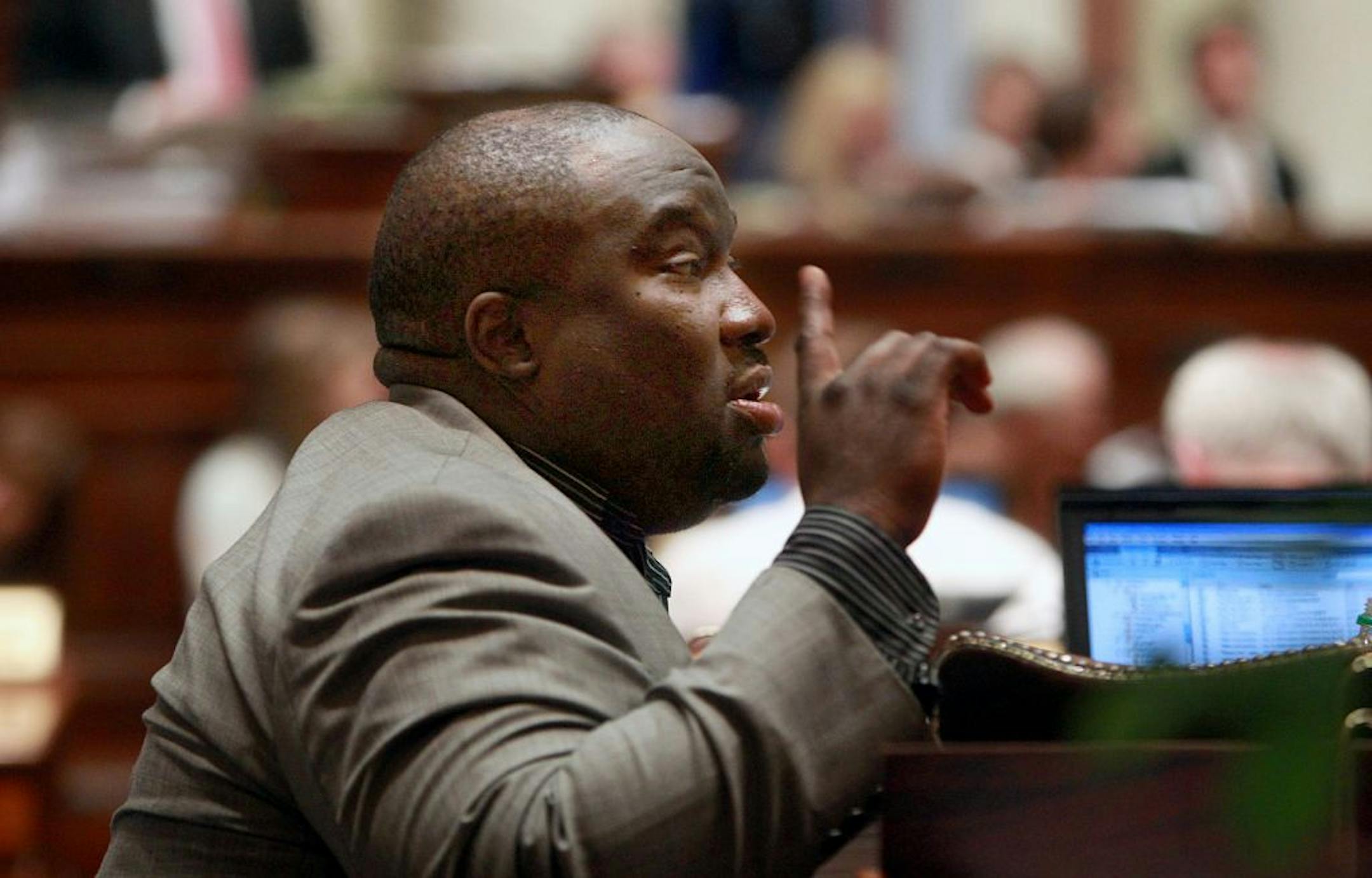 Representative Jeff Hayden (DFL-61B) talked with a colleague during a long session on Saturday afternoon.