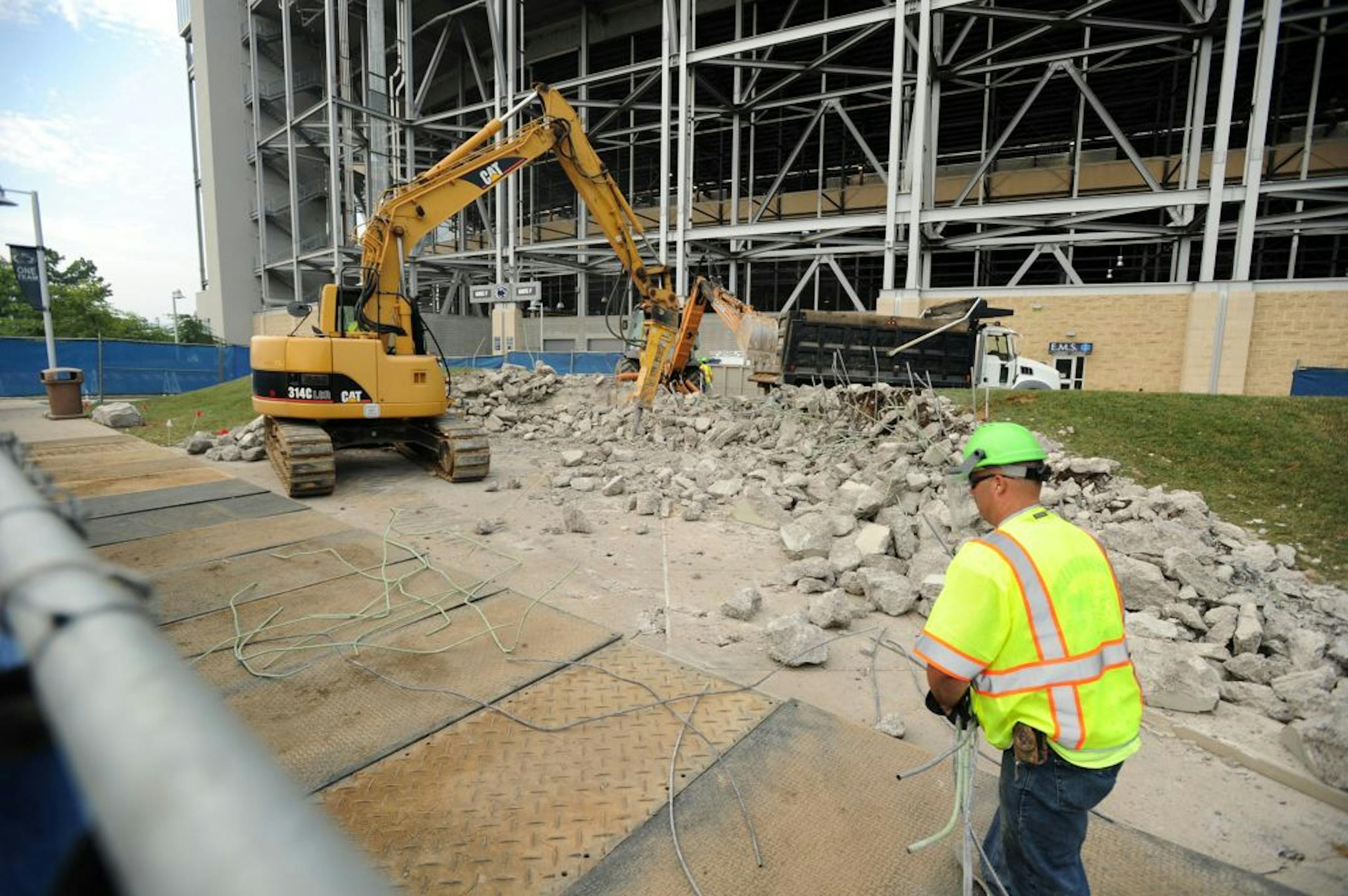 Penn State workers removed the concrete landing area that held the Joe Paterno statue on July 24.