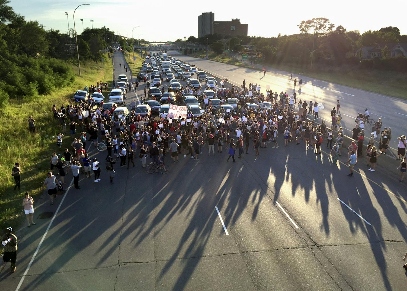 FILE - In this July 9, 2016 file photo, marchers block part of Interstate 94 in St. Paul, Minn., during a protest sparked by the recent police killings of black men in Minnesota and Louisiana. The killing of Philando Castile by a Minnesota police officer during a traffic stop last week tore open wounds that hadn't yet healed in Minnesota's black community from a previous officer-involved death last year. (Glen Stubbe/Star Tribune via AP, File)