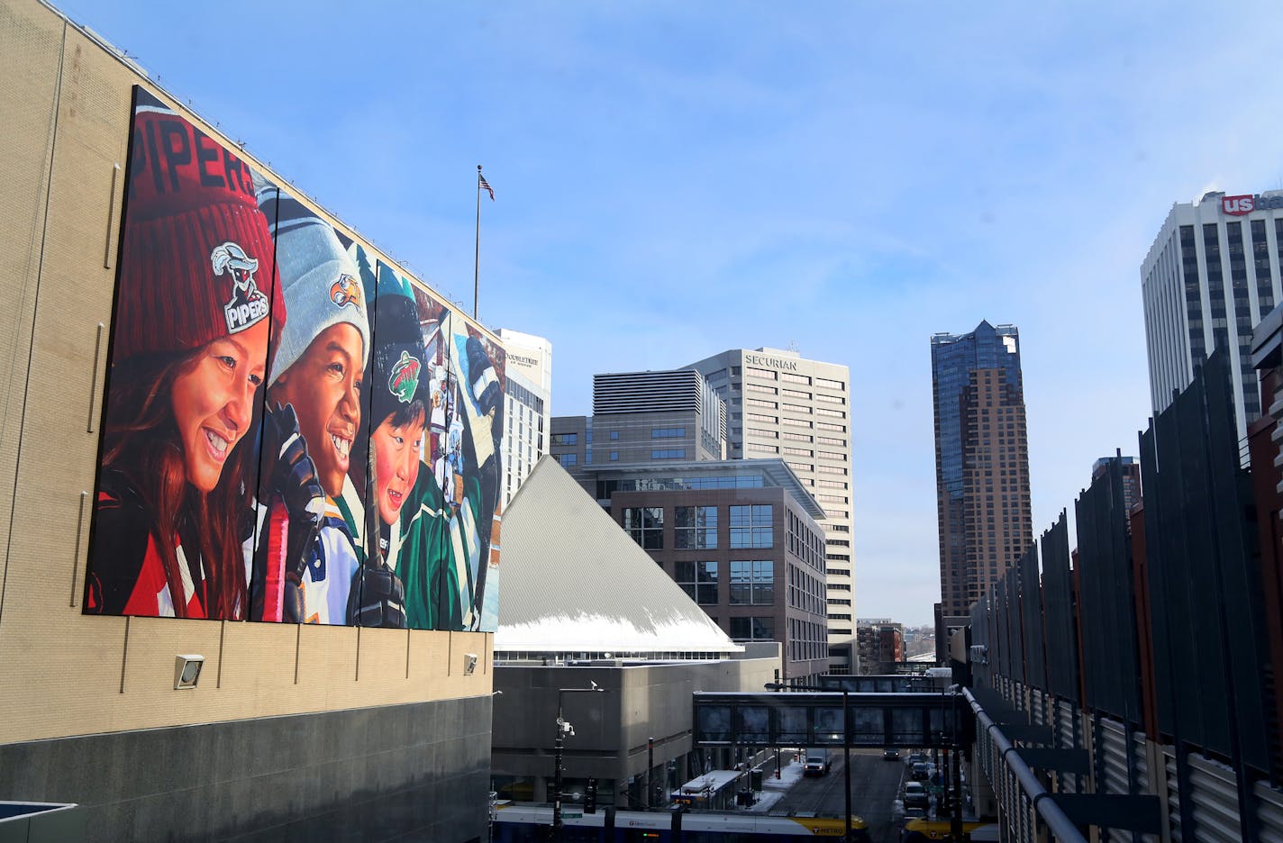 A large mural hangs on the back side of the Treasure Island Center building and seen during the Grand Opening Event Tuesday, Jan. 16, 2018, in St. Paul, MN.] DAVID JOLES &#xef; david.joles@startribune.com A once neglected department store has been transformed and positioned to rejuvenate the center of downtown Saint Paul as the Treasure Island Center is opening.**Josh Krsnak , Shelley Buckc,q