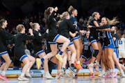 Minnetonka celebrates after defeating Hopkins in the Class 4A girls basketball state championship game at Williams Arena on Saturday, ending a state t