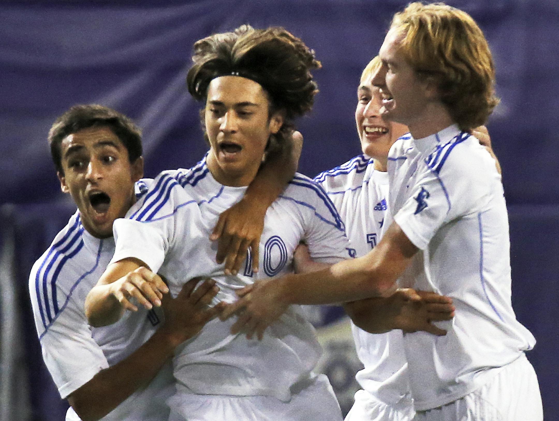 Class 2A soccer championship. Boys - Eastview Lightning vs. North St. Paul Polars. Lightning Sam Fluegge (10) was congratulated by teammates after he scored a goal in first half action. (MARLIN LEVISON/STARTRIBUNE(mlevison@startribune.com) ORG XMIT: MIN1310311843335481