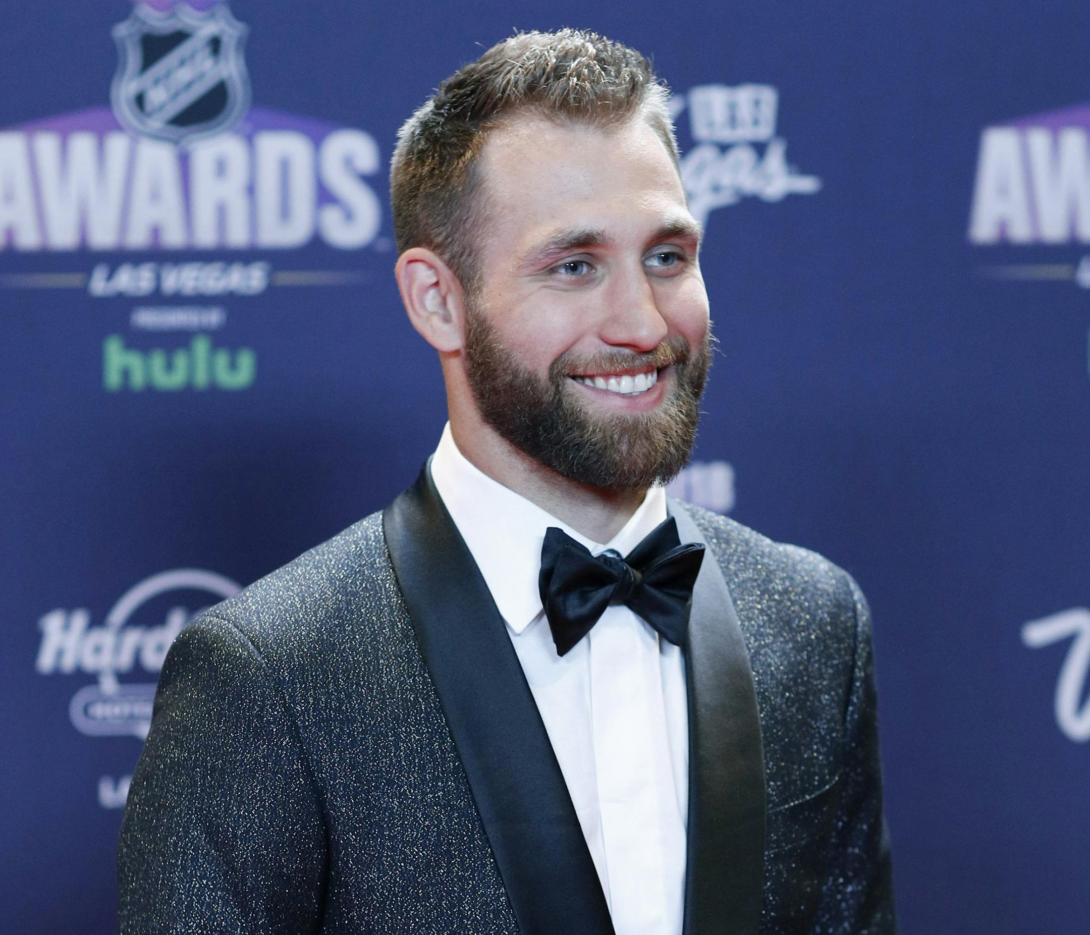 Jason Zucker of the Minnesota Wild poses on the red carpet before the NHL Awards, Wednesday, June 20, 2018, in Las Vegas. (AP Photo/John Locher)