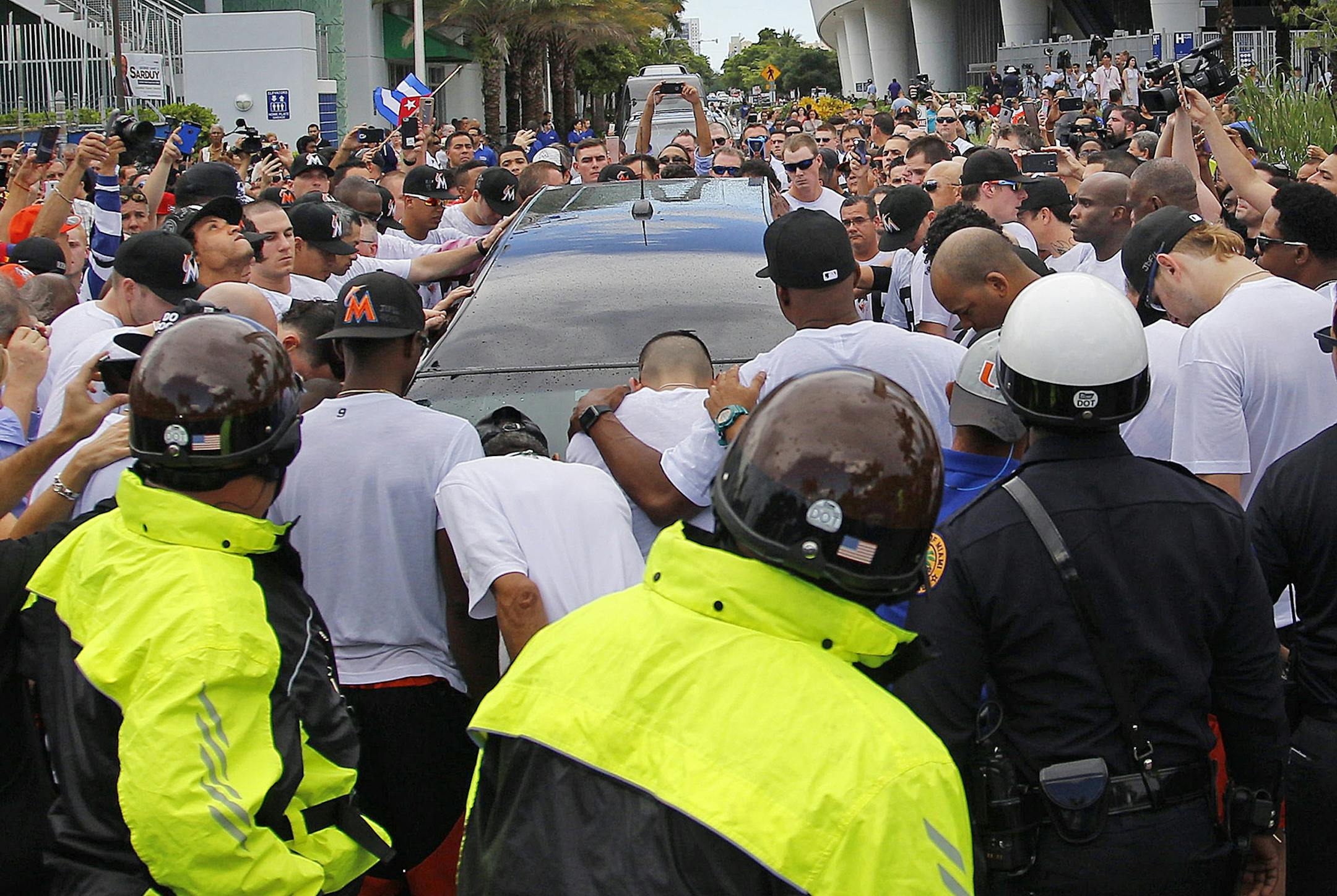 Marlins players stand around the hearse in silence as they pay their respects to teammate Jose Fernandez at Marlins Park on Sept. 28, 2016 in Miami. (Carl Juste/Miami Herald/TNS) ORG XMIT: 1190870
