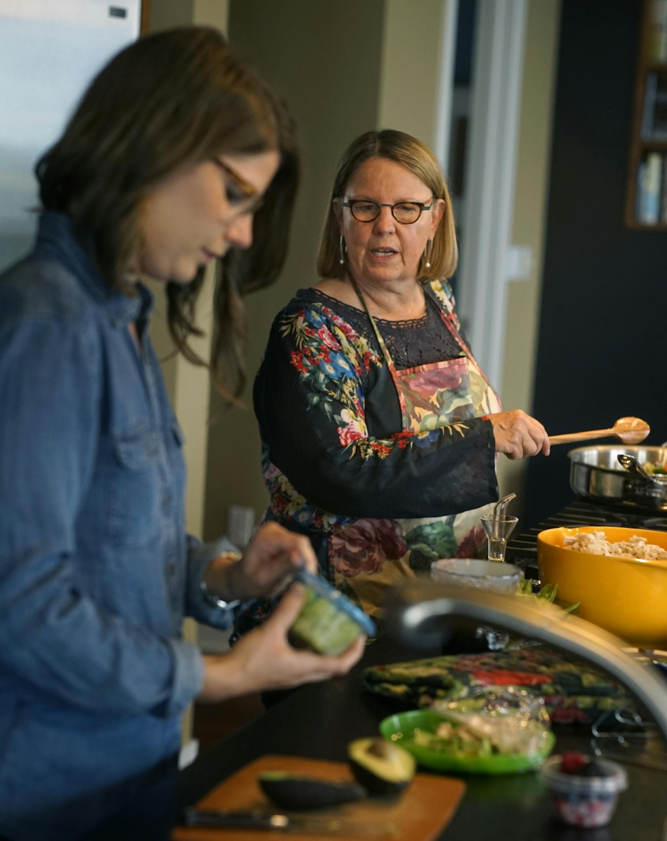 Betsy Kuller and her mother, Susie Kuller, cook together at the Carlyle where both have condos.