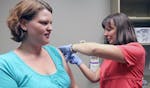Nurse Helena Gustafson gave Stephanie Pelach a seasonal flu shot at the Fairview clinic in New Brighton. Pregnant women such as Pelach are being urged