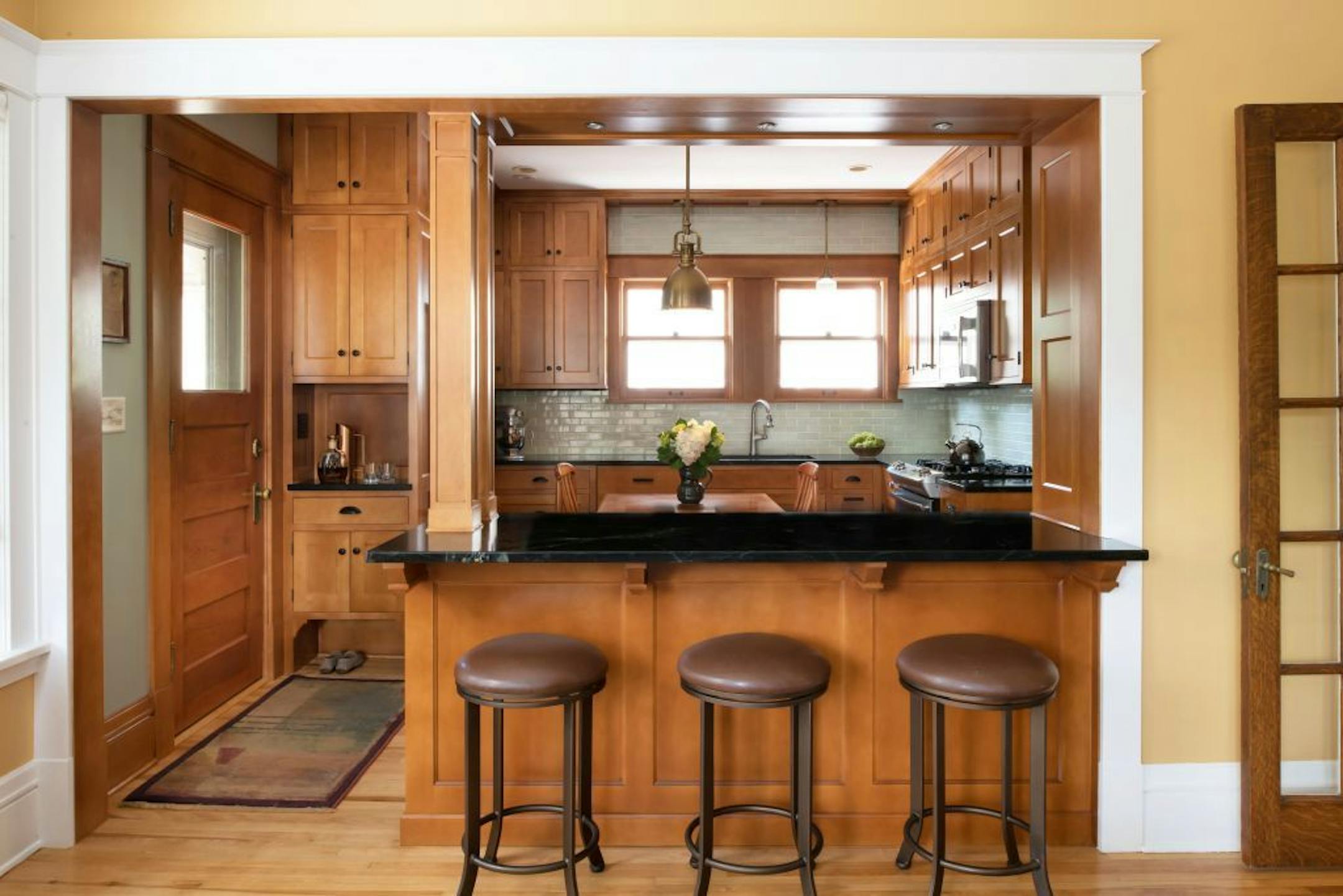 Now there's an opening and countertop with seating where the wall used to be.