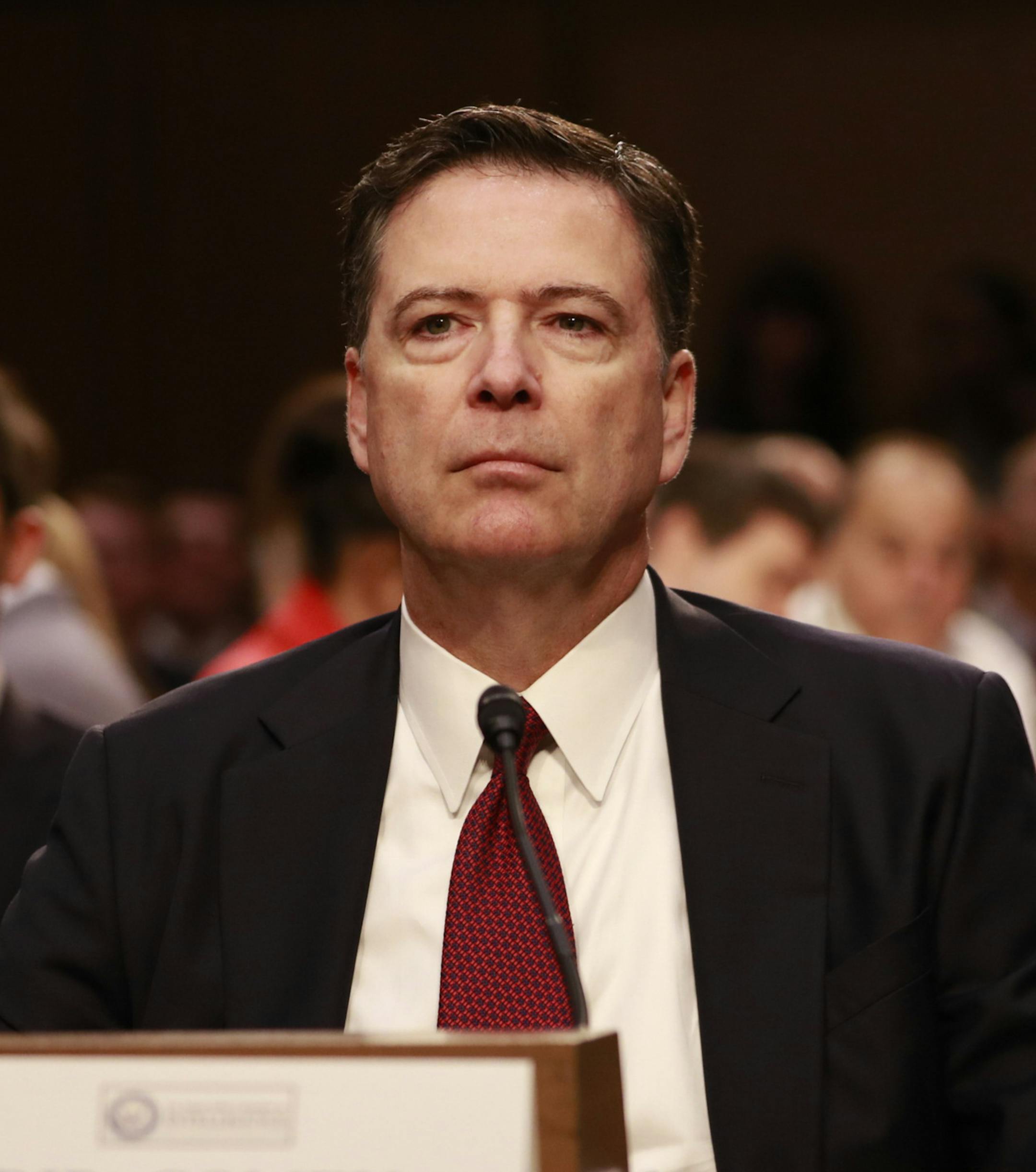 FILE -- Then FBI director James Comey during his testimony before the Senate Select Committee on Intelligence, on Capitol Hill in Washington, June 8, 2017. The timeline of activity that led to Special Counsel Robert Mueller's charges against three former Trump campaign advisers stretches back over two years. (Doug Mills/The New York Times)