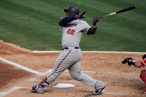 Miguel Sano follows through on a grand slam against the Los Angeles Angels during the first inning of Game 2 on Thursday
