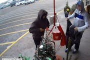 Police are asking for help in finding two suspects in hoods that stole the Salvation Army red kettle Tuesday at a Cub Foods in Blaine.