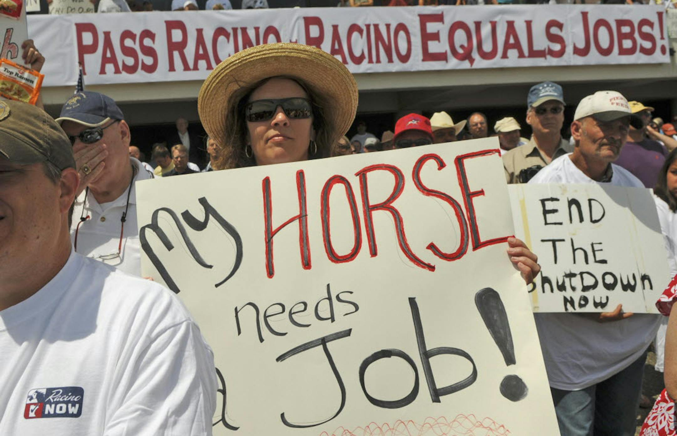 Rosemary Higgins of Princeton, Minn., who owns quarters horses and wants the racing season to continue as soon as possible at Canterbury Park, joined a rally Wednesday in Shakopee.