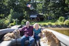John and Diane Harvey, with their dogs, live on Coon Lake in East Bethel.