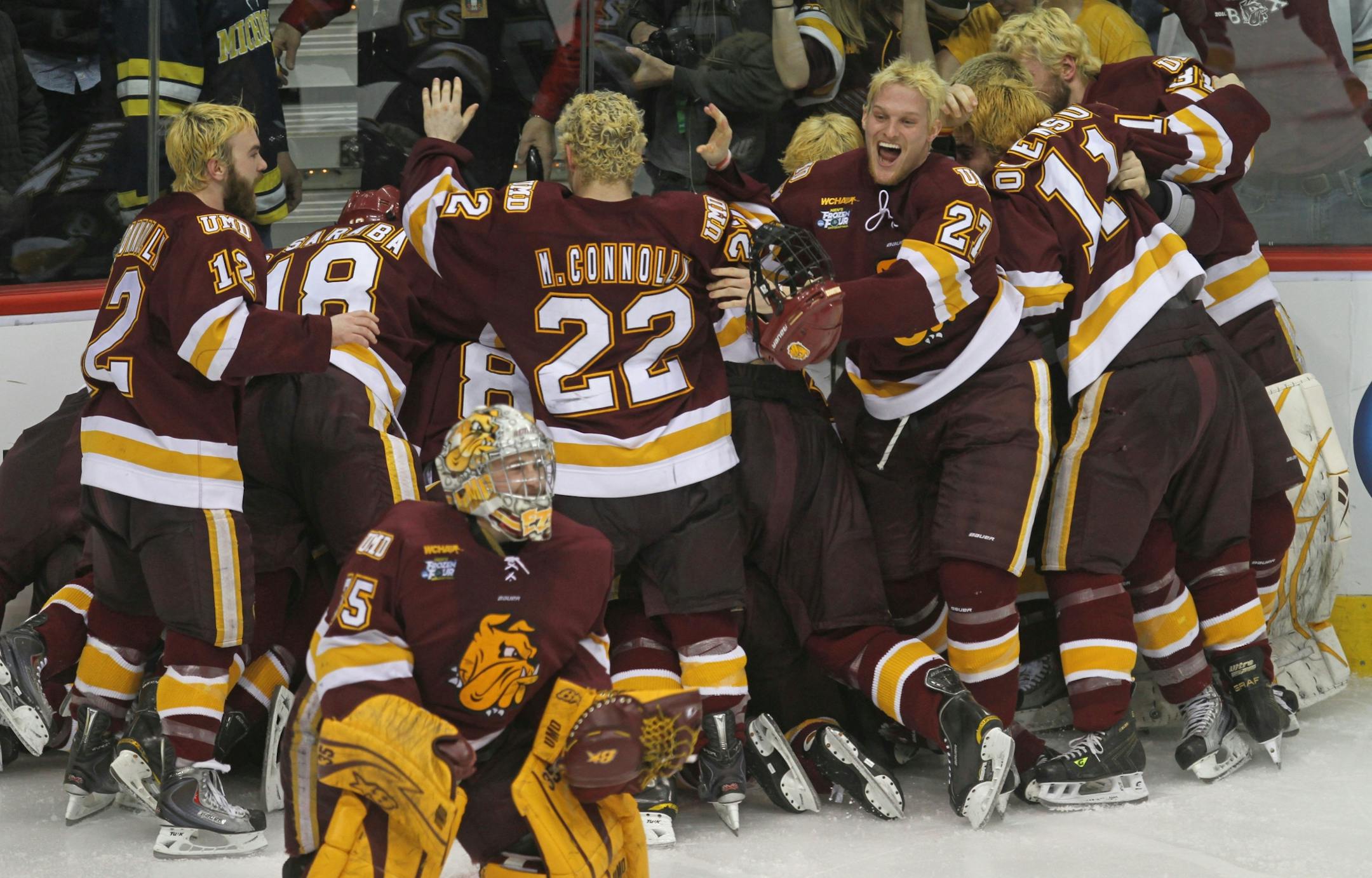 NCAA Frozen Four Finals, Minnesota Duluth vs Michigan. (left to right) The Minnesota Duluth Bulldogs celebrated their overtime goal and their national championship win over Michigan.