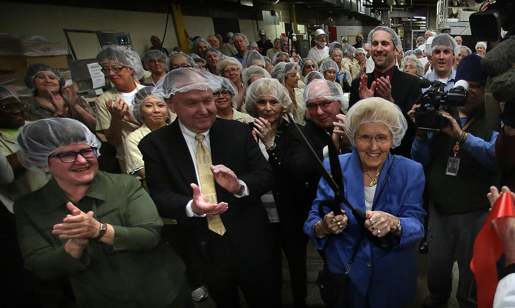 Long-time Pearson candy enthusiast Elsie Syverson, 92, Minnetonka, cut a ribbon on the manufacturing line to mark the first time that Bit-O-Honey candy has been made at Pearson‚Äôs factory on West Seventh Street in St. Paul. The confection, a brand acquired in 1924, was previously manufactured in Illinois. The move will create at least 40 jobs according the company. ] JIM GEHRZ ‚Ä¢ jgehrz@startribune.com / St. Paul, MN / March 26, 2014 / 11:00 AM / BACKGROUND IN