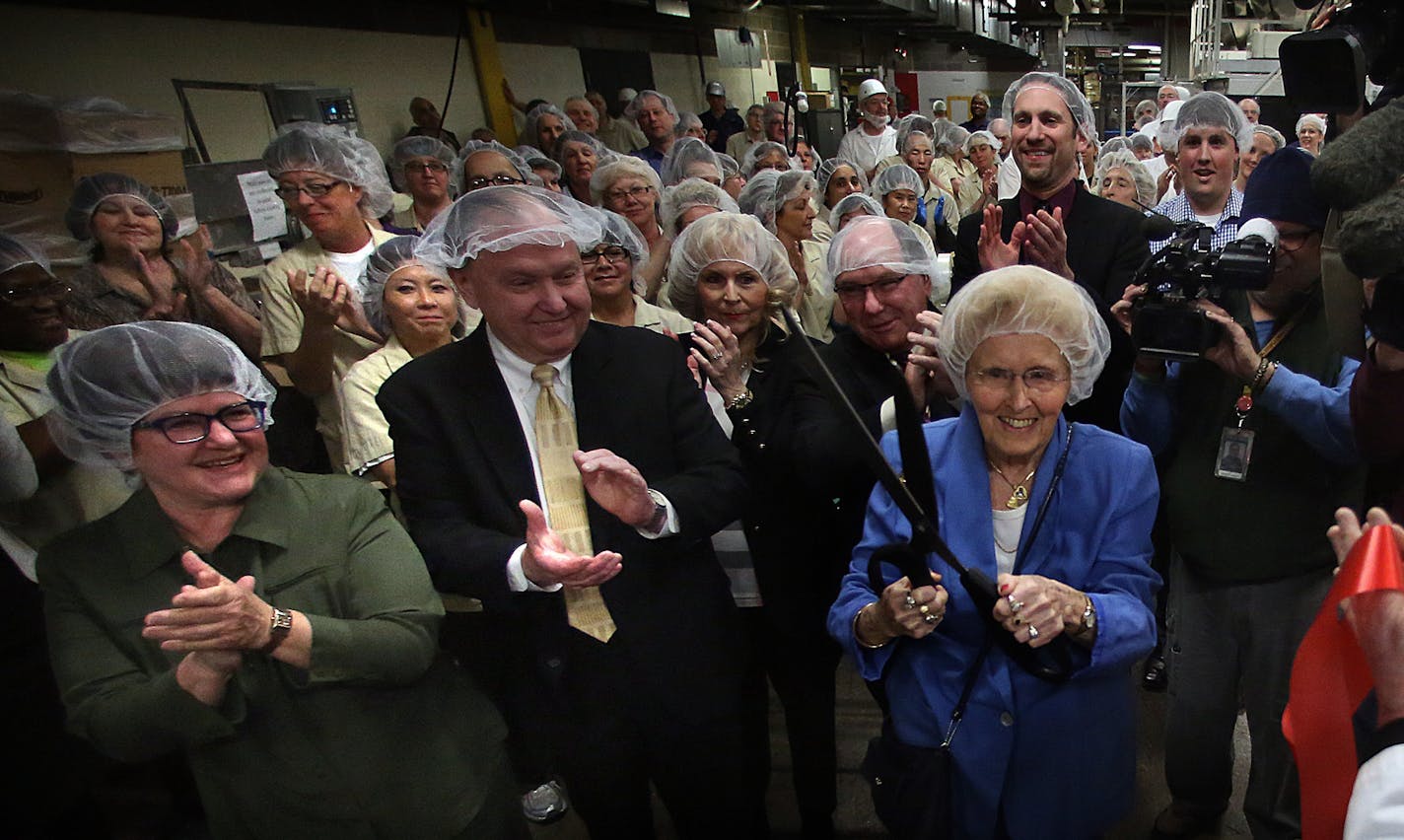 Long-time Pearson candy enthusiast Elsie Syverson, 92, Minnetonka, cut a ribbon on the manufacturing line to mark the first time that Bit-O-Honey candy has been made at Pearson&#x201a;&#xc4;&#xf4;s factory on West Seventh Street in St. Paul. The confection, a brand acquired in 1924, was previously manufactured in Illinois. The move will create at least 40 jobs according the company. ] JIM GEHRZ &#x201a;&#xc4;&#xa2; jgehrz@startribune.com / St. Paul, MN / March 26, 2014 / 11:00 AM / BACKGROUND IN