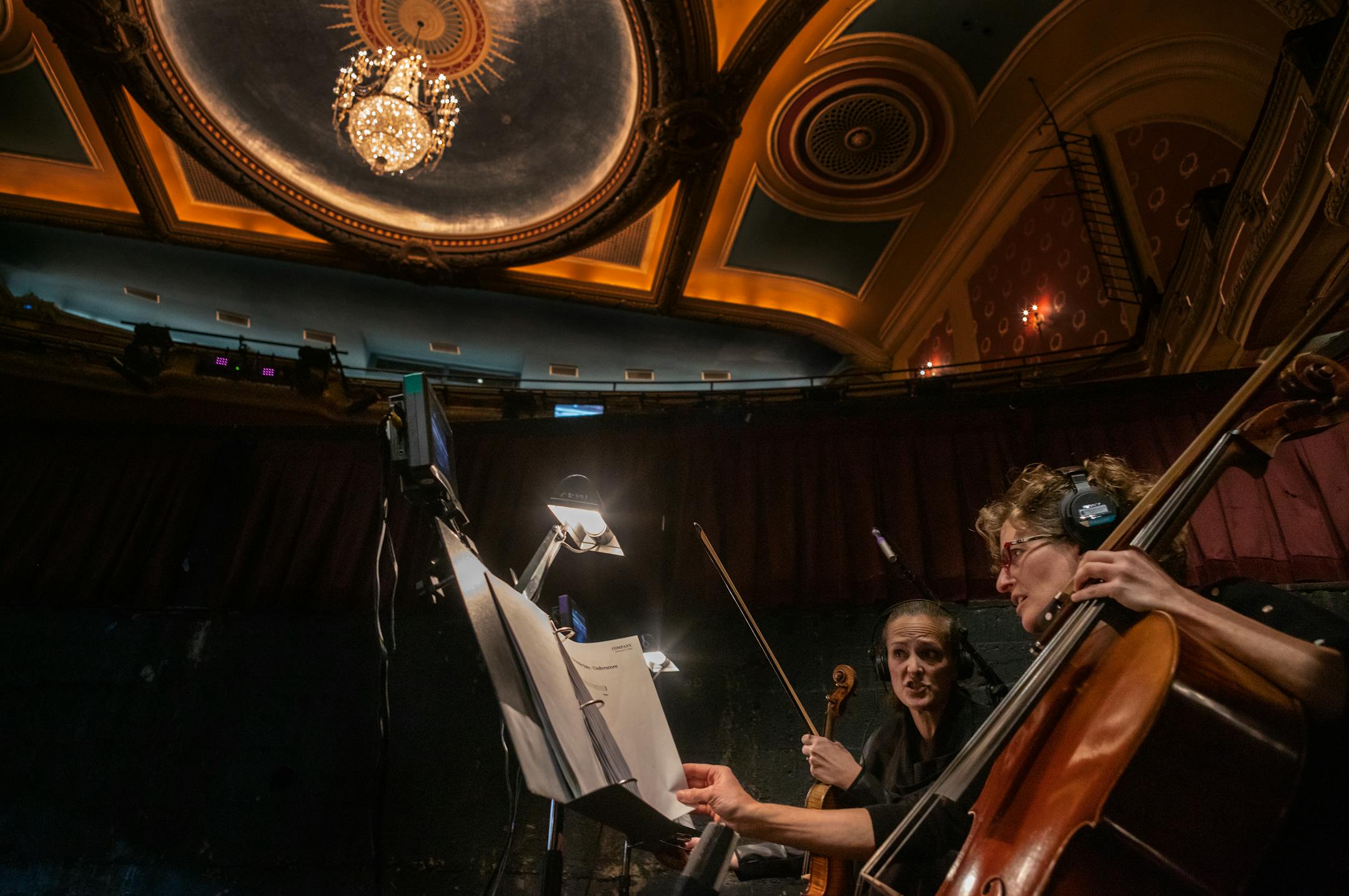 Local musicians Maisie Block, left, on violin and Rebecca Arons on cello discuss during rehearsal with local band members at the Orpheum Theatre on Nov. 14, 2023 in Minneapolis.
