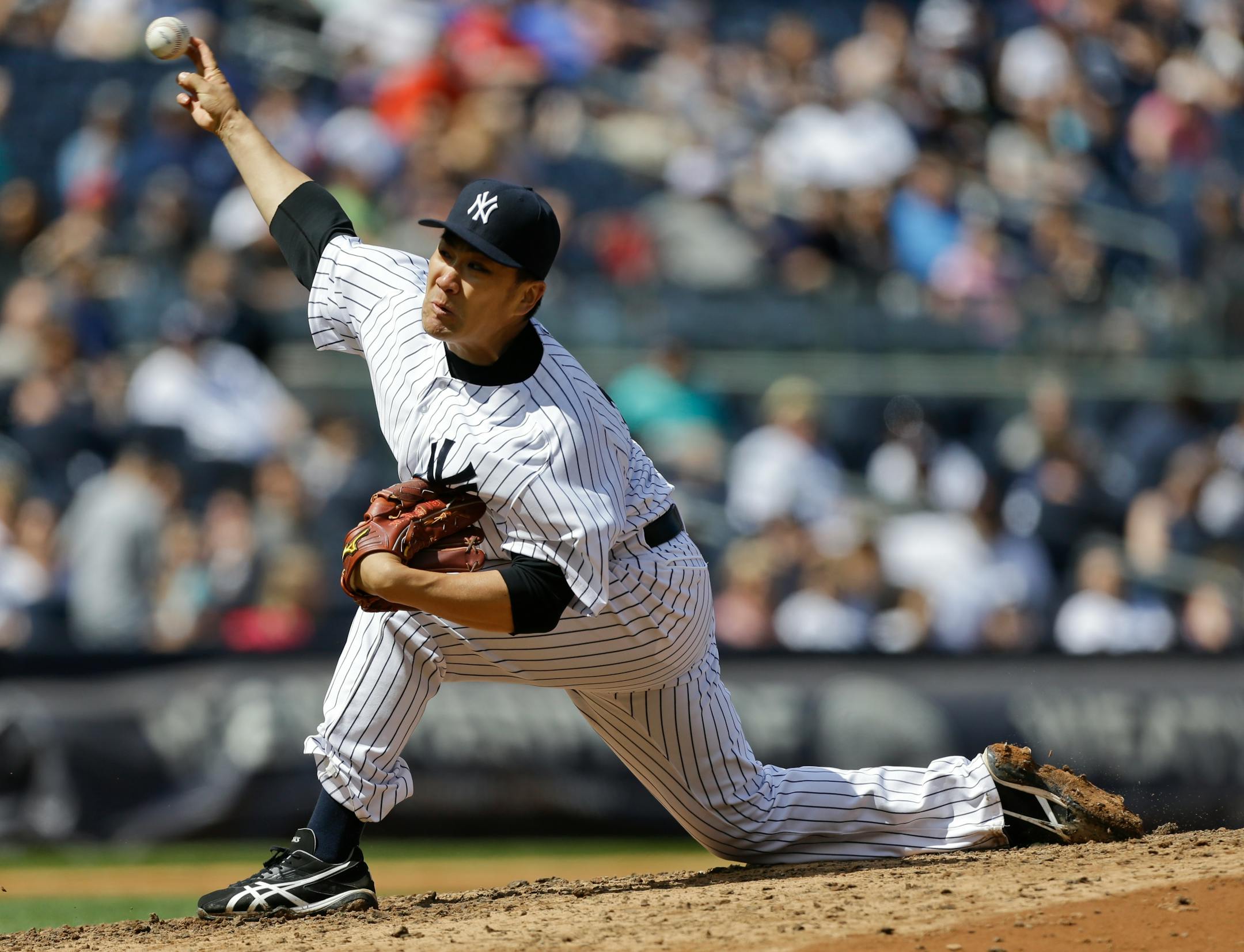 New York Yankees' Masahiro Tanaka, of Japan, delivers a pitch during the seventh inning of a baseball game against the Minnesota Twins Saturday, May 31, 2014, in New York. (AP Photo/Frank Franklin II)