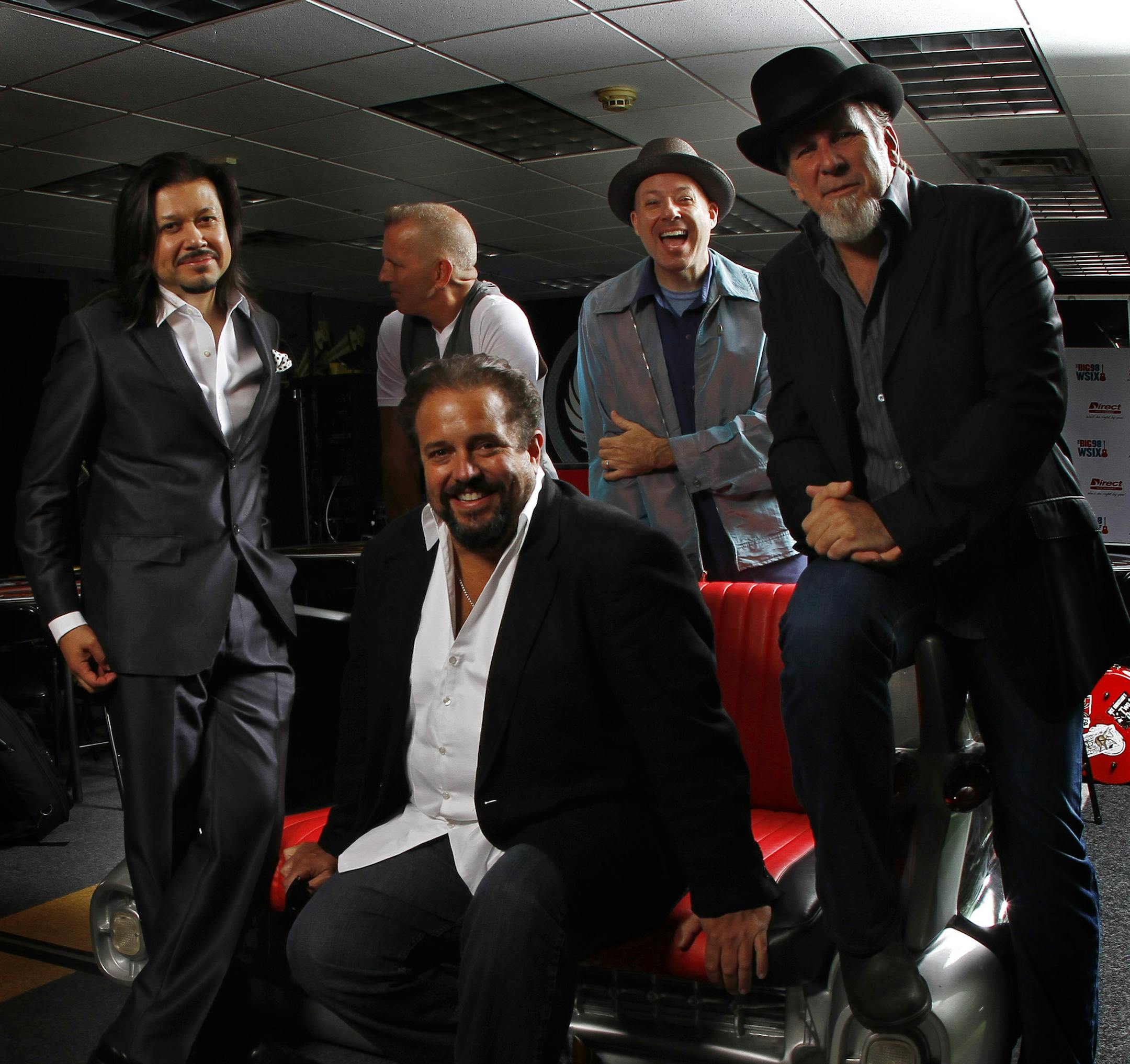 Raul Malo, seated, of musical group the Mavericks, poses for a portrait with band members Eddie Perez, left, Paul Deakin, left center Jerry Dale O'Connell, right center and Robert Reynolds, right, on Tuesday, June 5, 2012 in Nashville, Tenn. (Photo by Wade Payne/Invision/AP) ORG XMIT: TNWP104