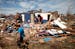 Residents in Moore, Oklahoma, sort through the rubble for personal items on Wednesday, May 22, 2013. A massive tornado struck the town on Monday.