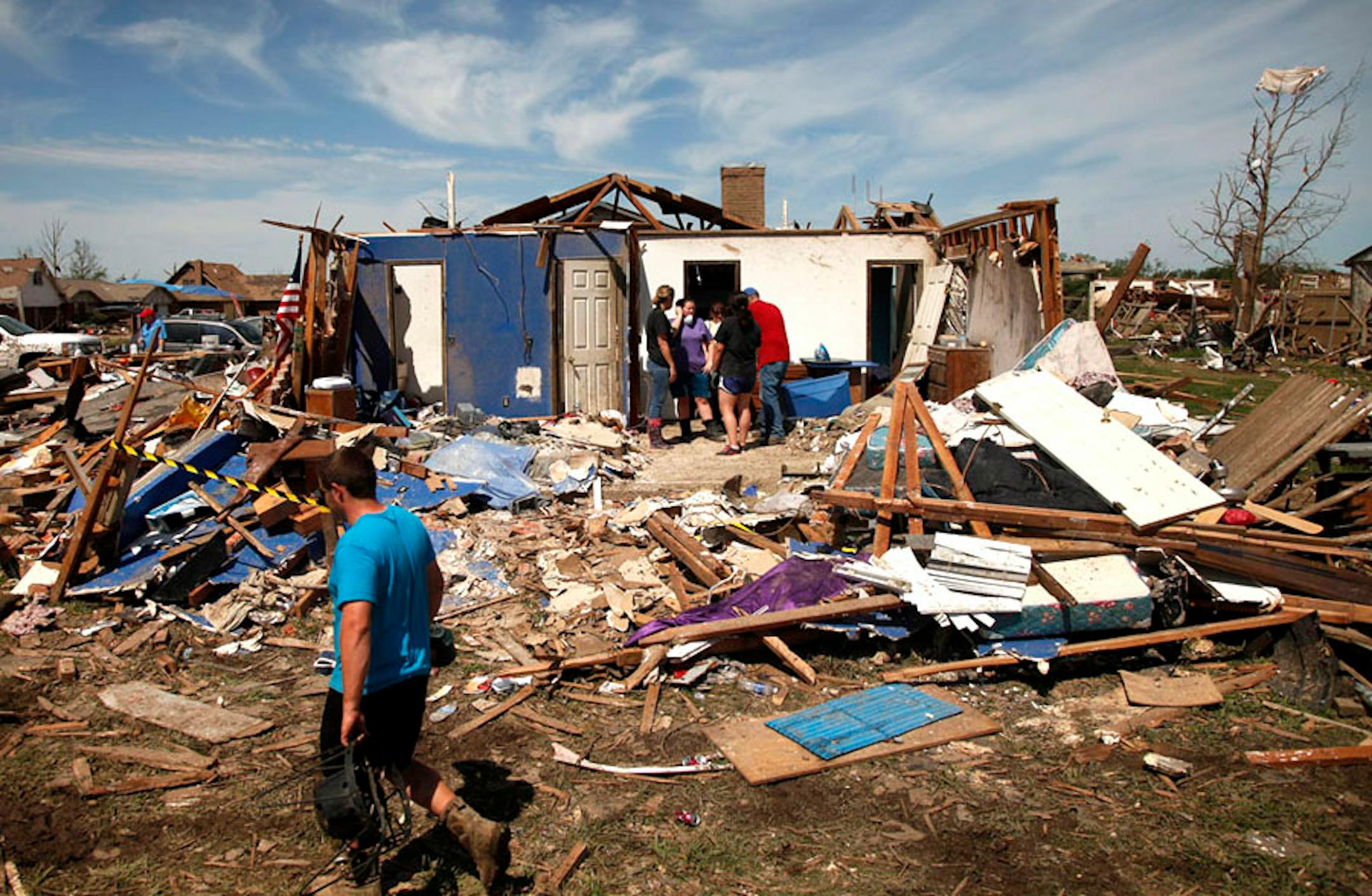 Residents in Moore, Oklahoma, sort through the rubble for personal items on Wednesday, May 22, 2013. A massive tornado struck the town on Monday.