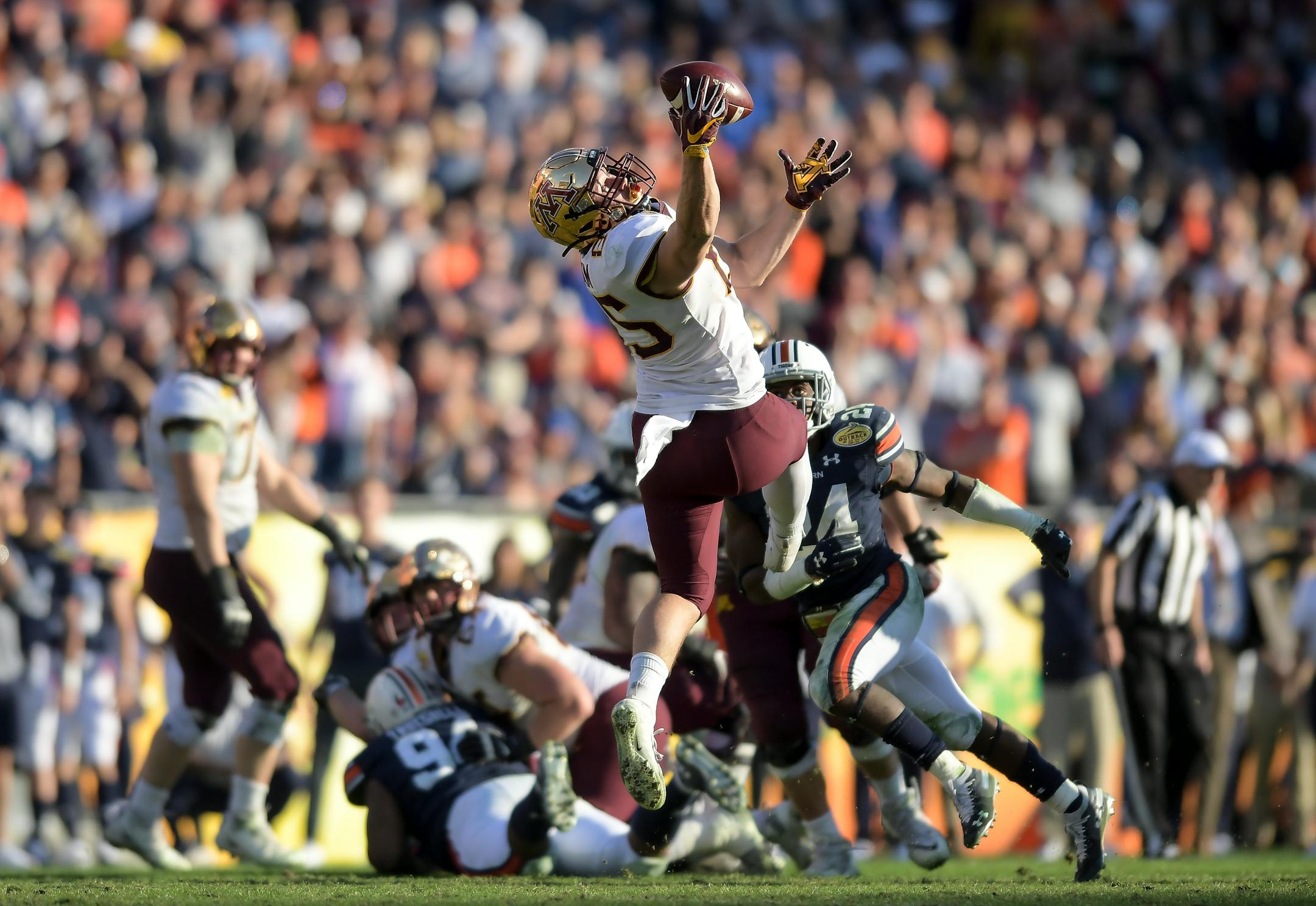 Gophers interim offensive coordinator Matt Simon gambled and won on a fourth-and-1 in the fourth quarter when tight end Bryce Witham hauled in a one-handed catch for a first down.