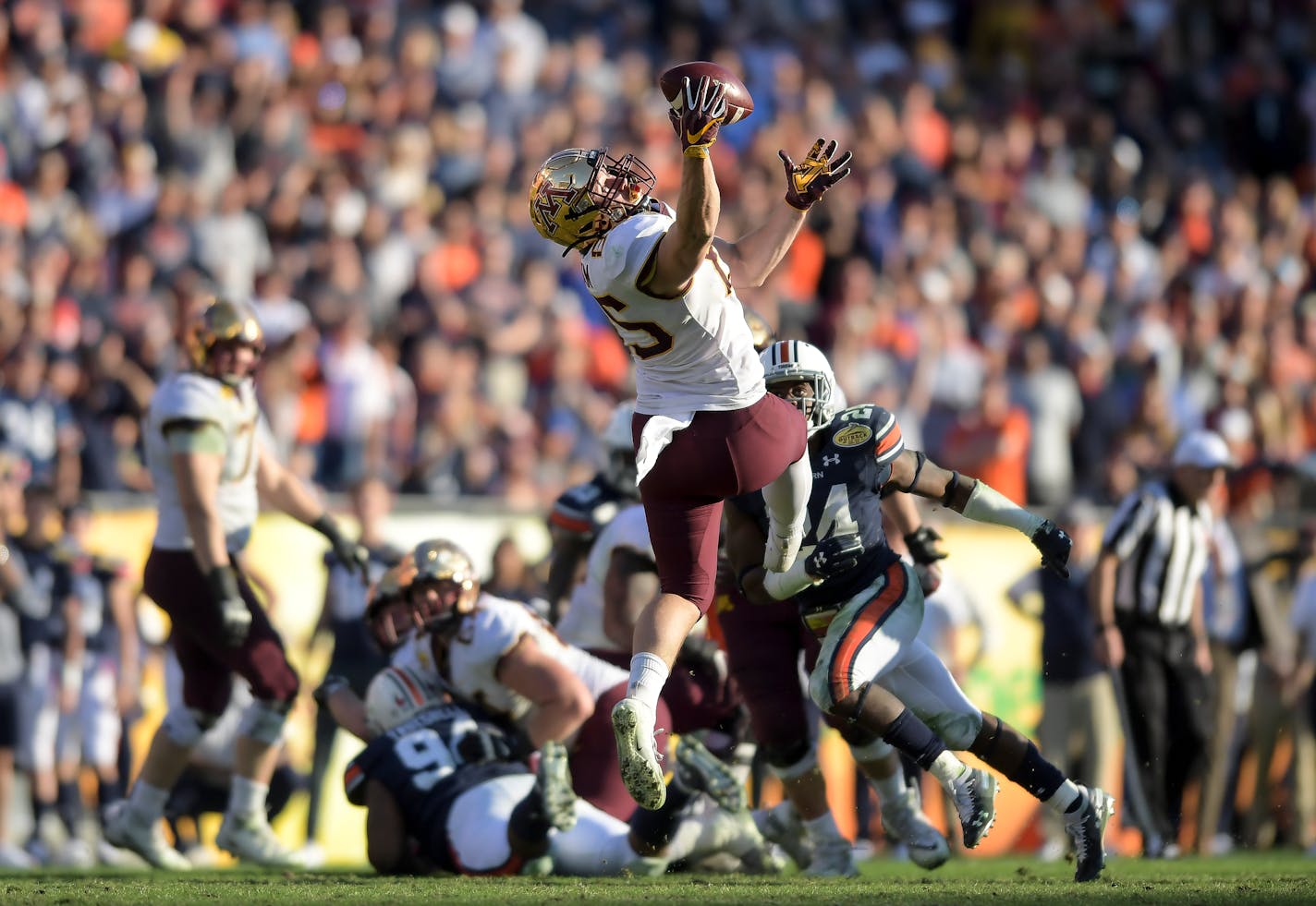 Gophers interim offensive coordinator Matt Simon gambled and won on a fourth-and-1 in the fourth quarter when tight end Bryce Witham hauled in a one-handed catch for a first down.