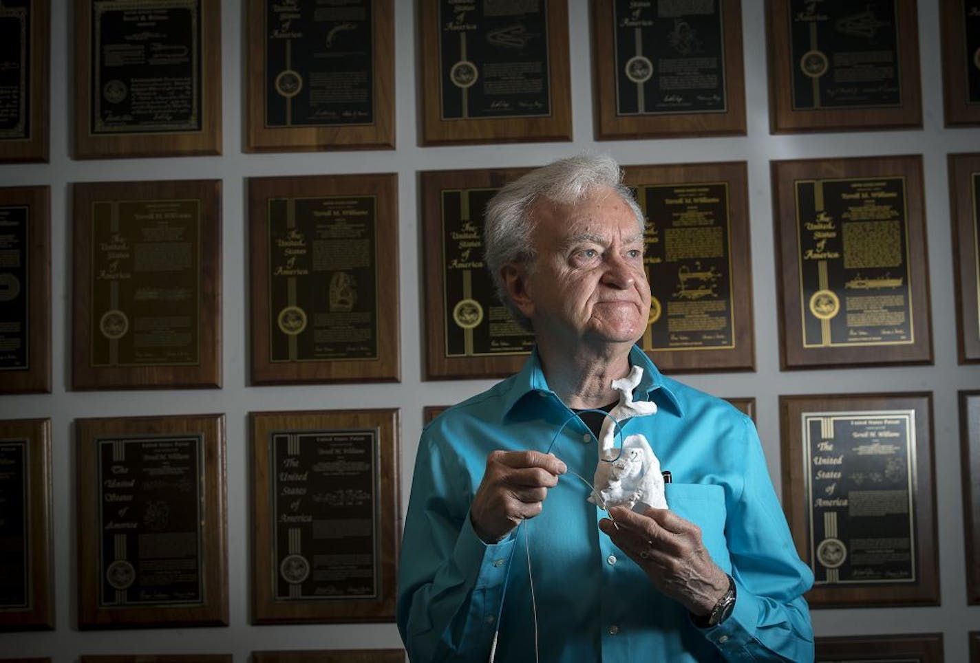 Terry Williams, a former Medtronic engineer who says he helped invent new technology for HIS bundle pacing, stood with the device in front of the many medical patents that lined the walls of his home, Tuesday, May 23, 2017 in Brooklyn Park, MN.