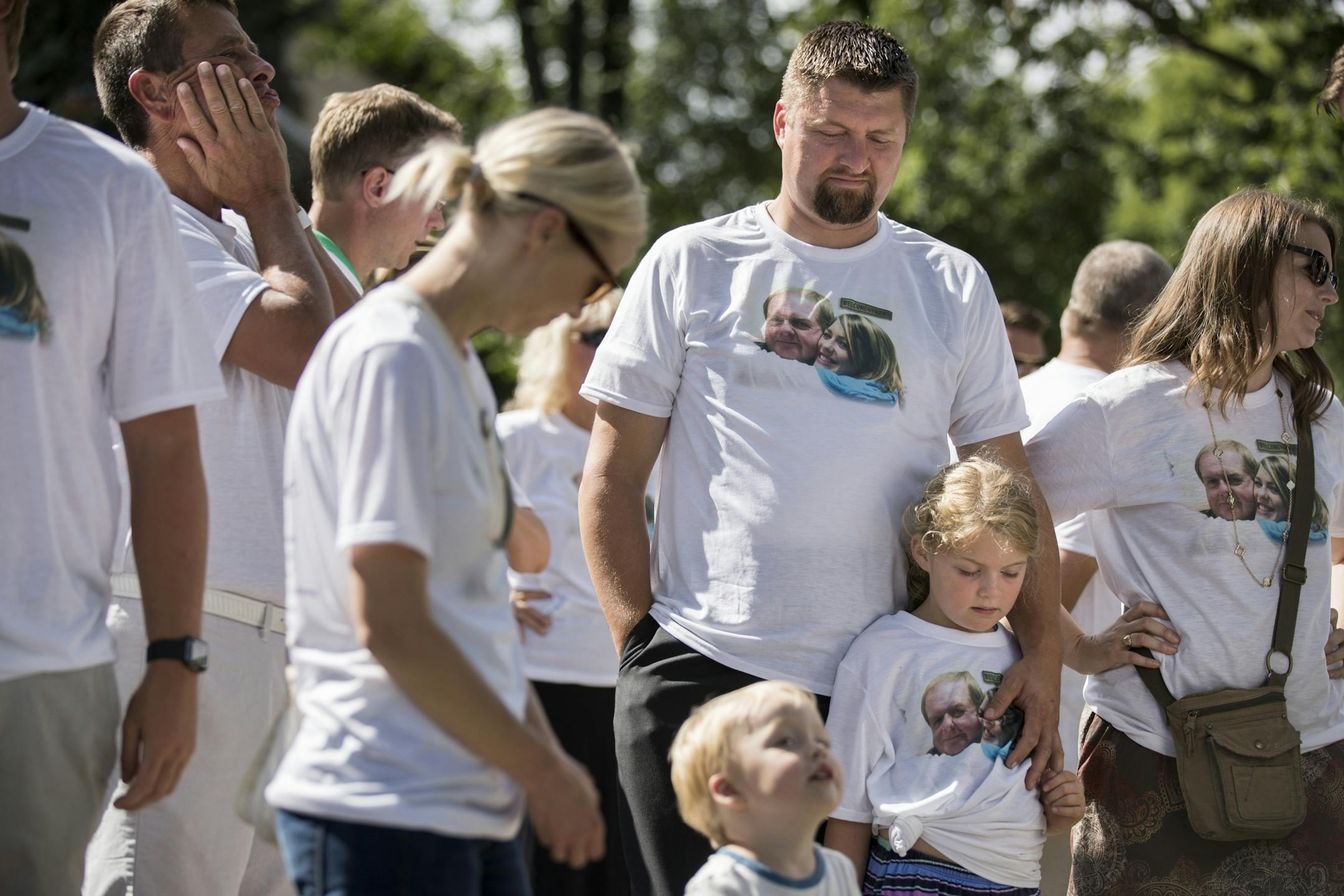 Family and friends gather during a memorial for Jessica Hanson in Minneapolis.