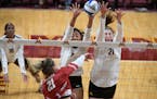 Gophers outside hitter Airi Miyabe (8) and middle blocker Regan Pittman (21) went up for a block attempt against Wisconsin. Miyabe left her native Jap